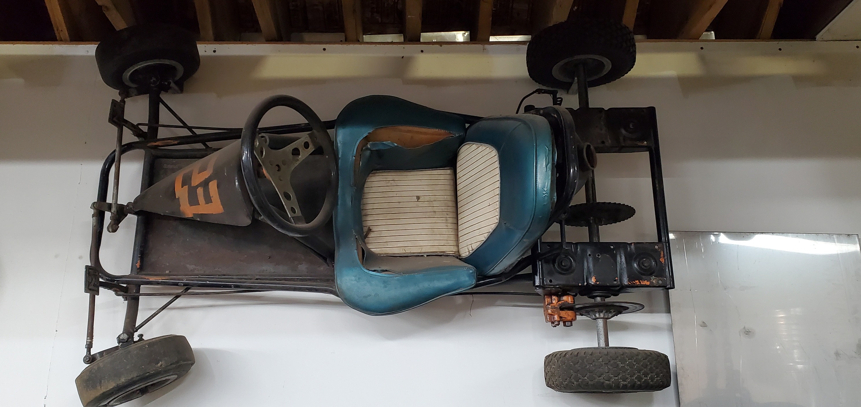 Vintage racing cart with twin McCulloch MC-10's at local car parts