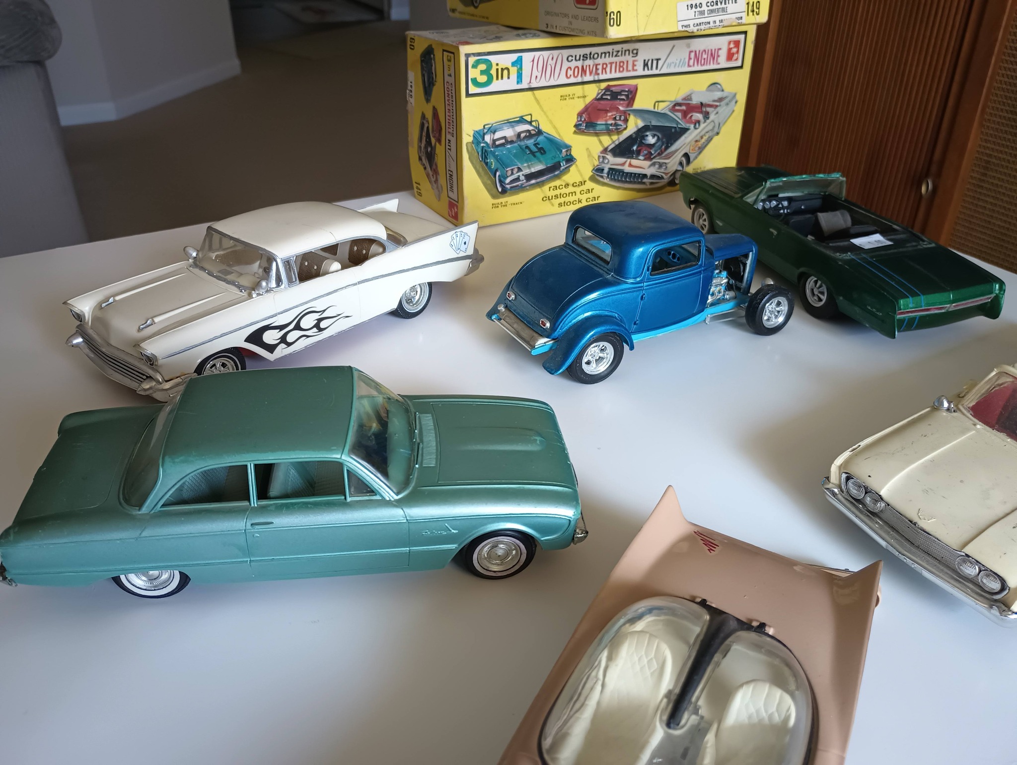 What is the beige car in the toy collection?