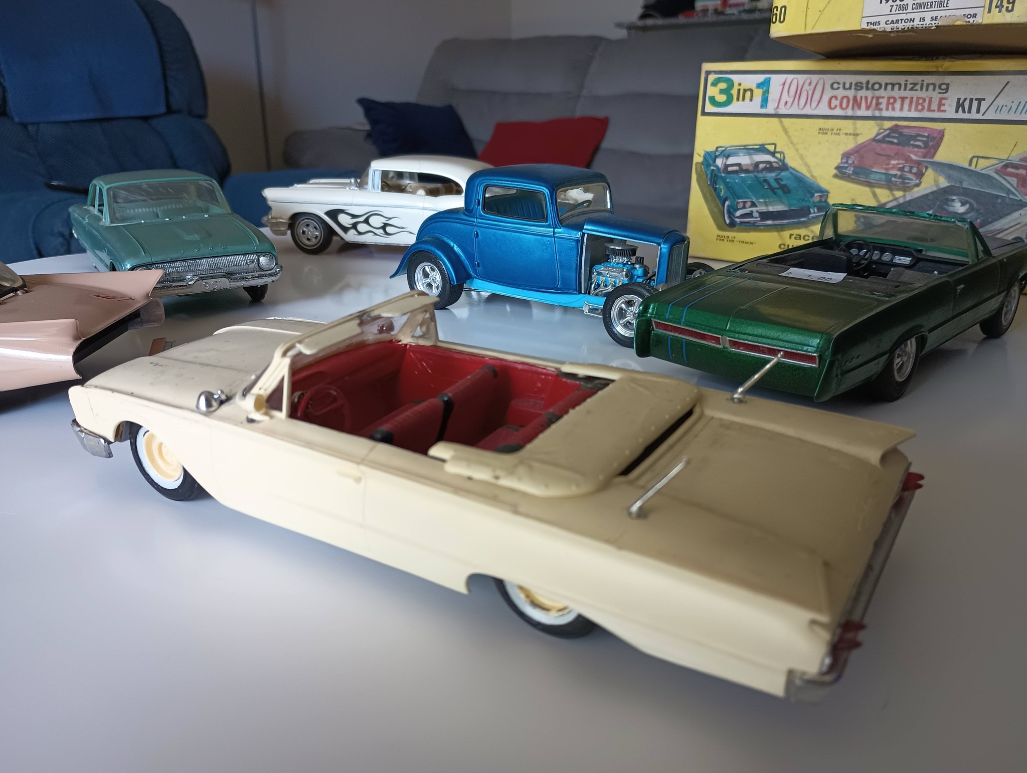 What is the beige car in the toy collection?