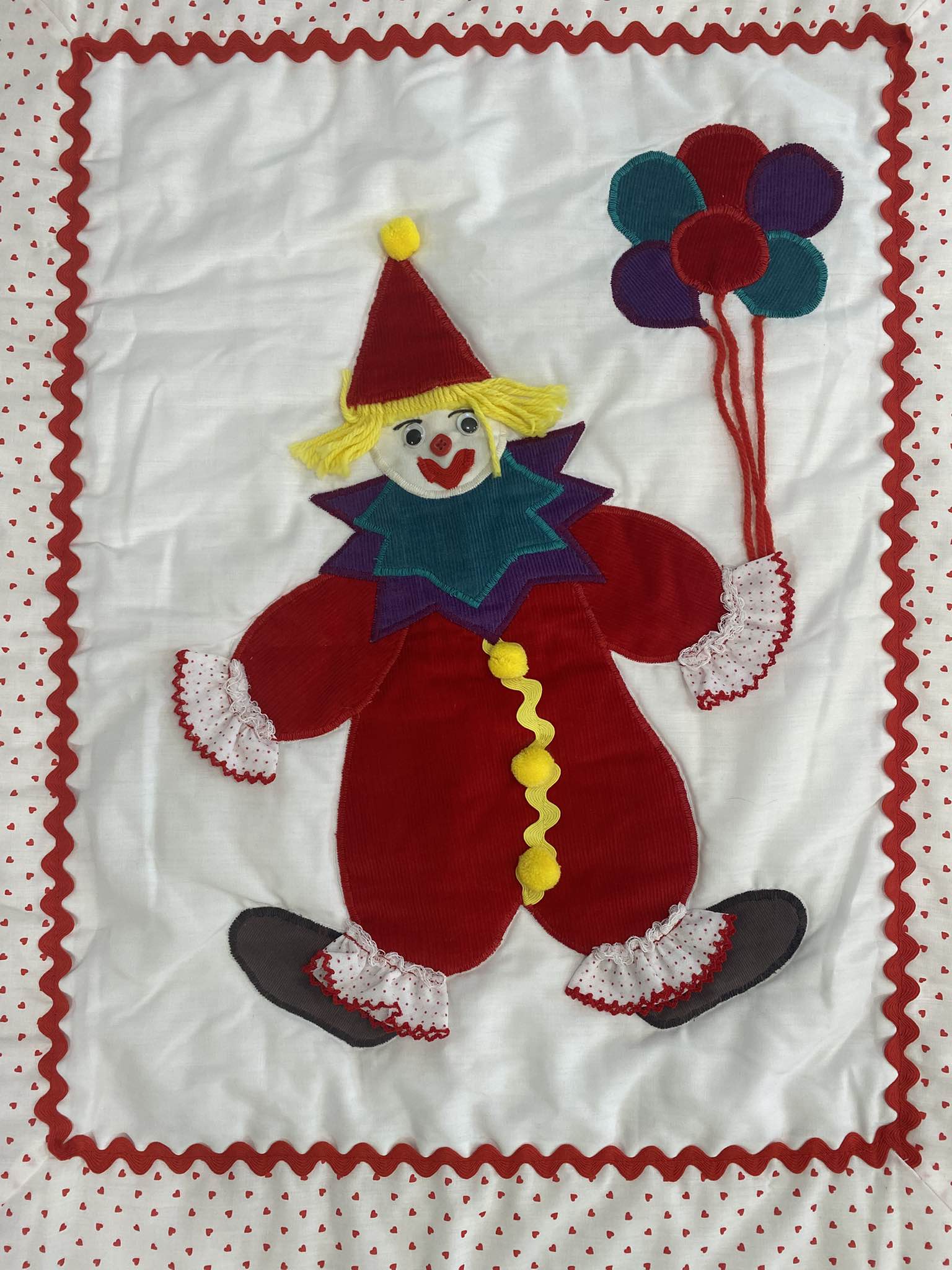 Handmade vintage clown wall hanging quilt features a central