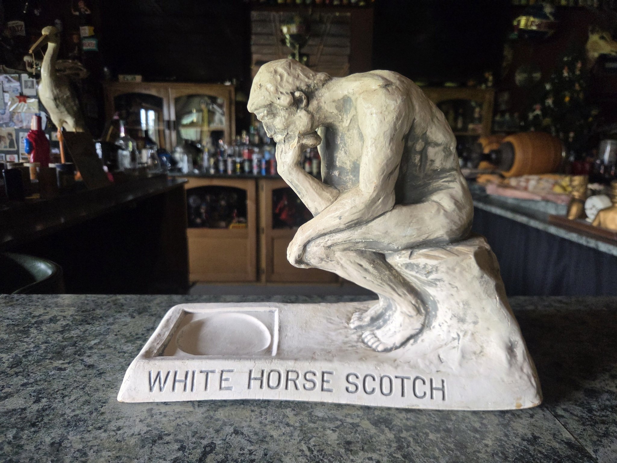 A rare early original collectible figure branded 'White Horse
