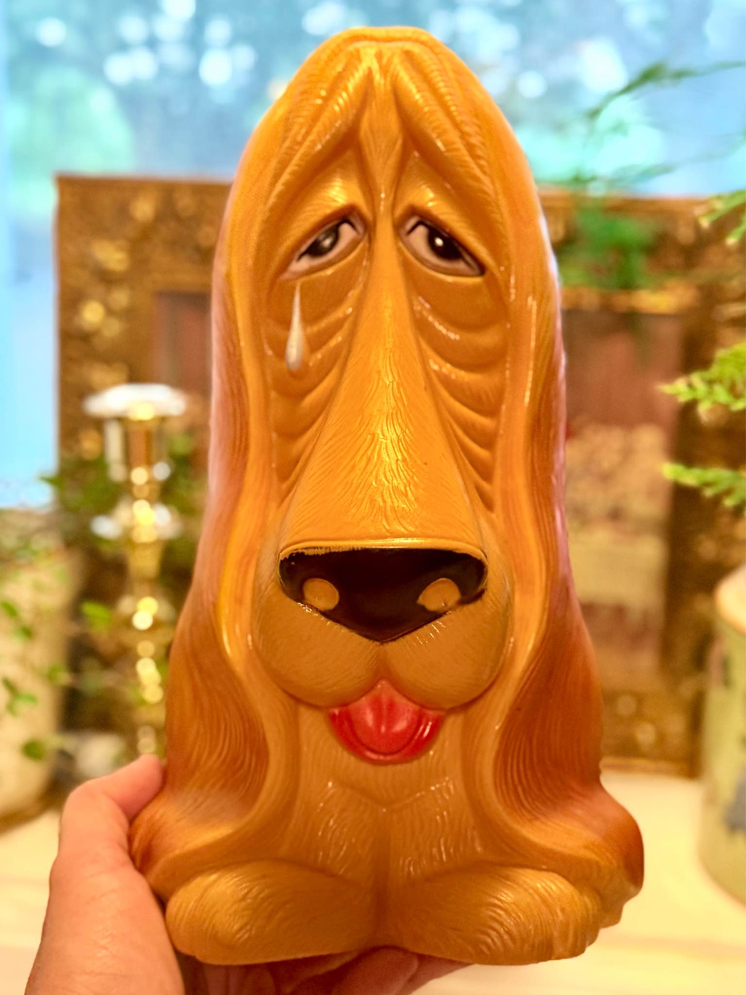 Vintage sad eyes plastic basset hound coin bank featuring droopy