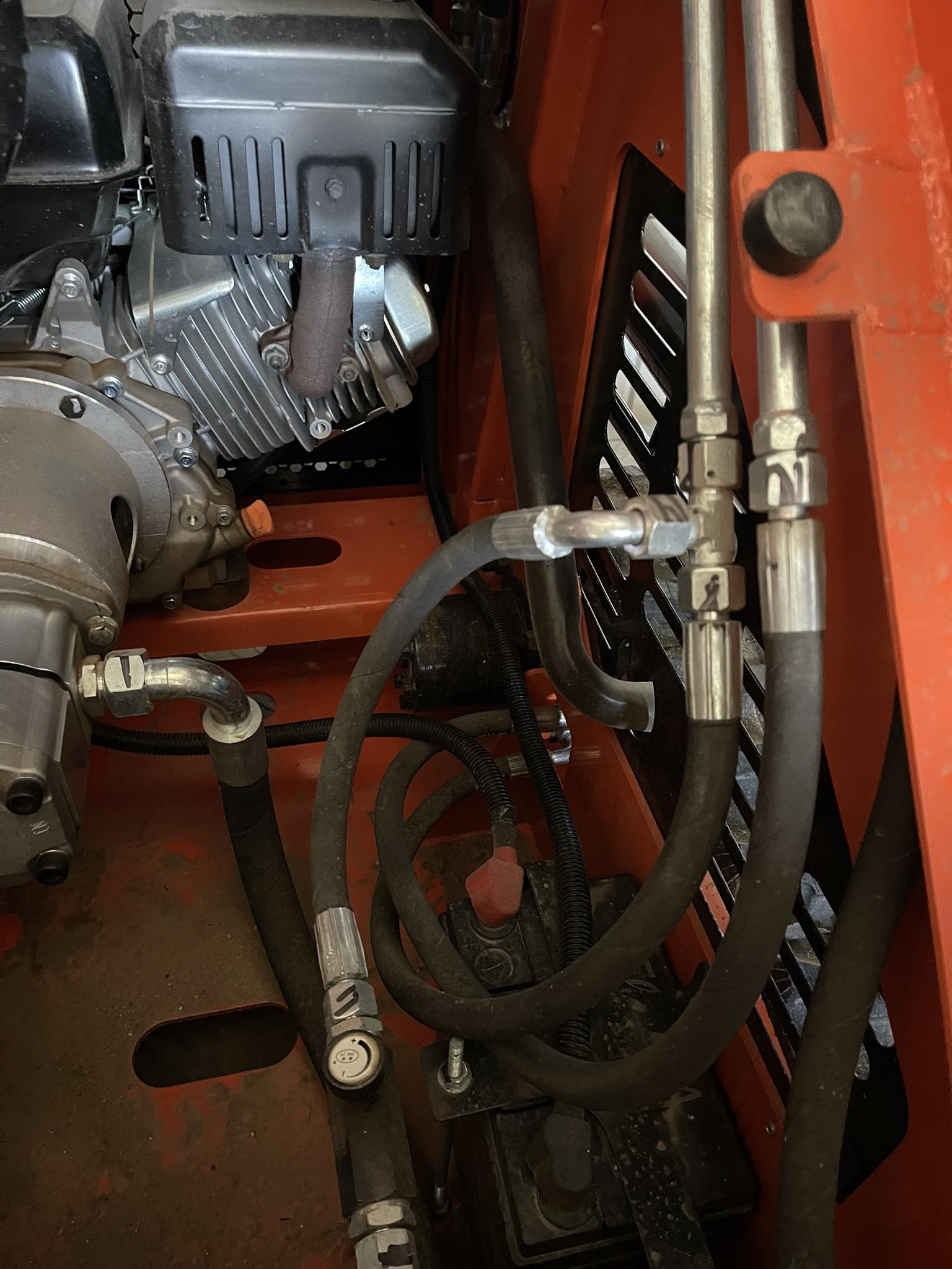 What is the function of needle valves on track drive motor circuit?
