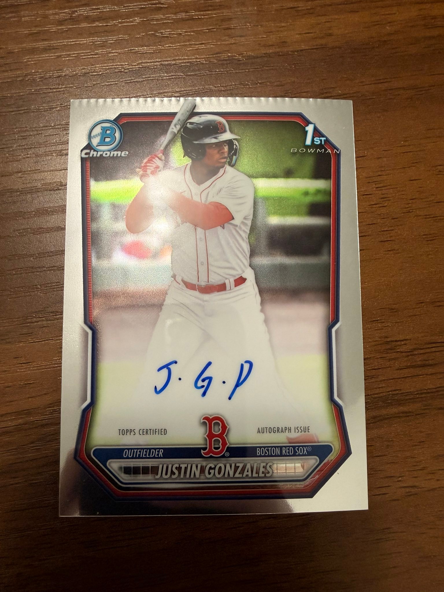 Is a damaged Justin Gonzales Bowman Chrome autograph card worth 