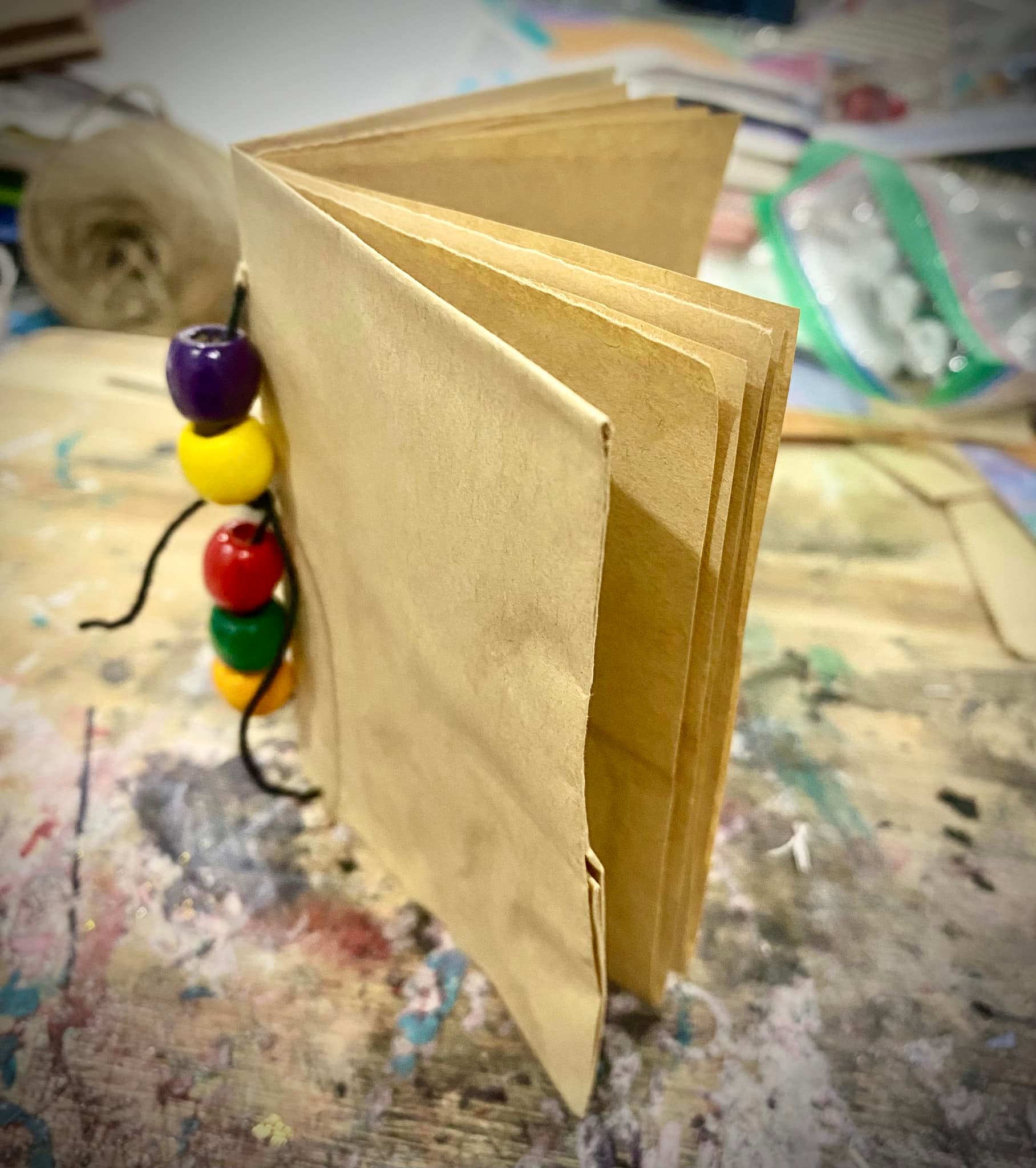 Paper bag journal covers made from folded bag bottoms