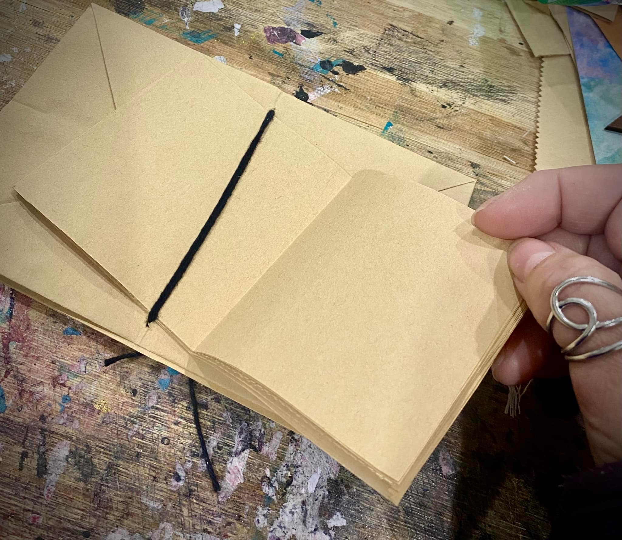 Paper bag journal covers made from folded bag bottoms