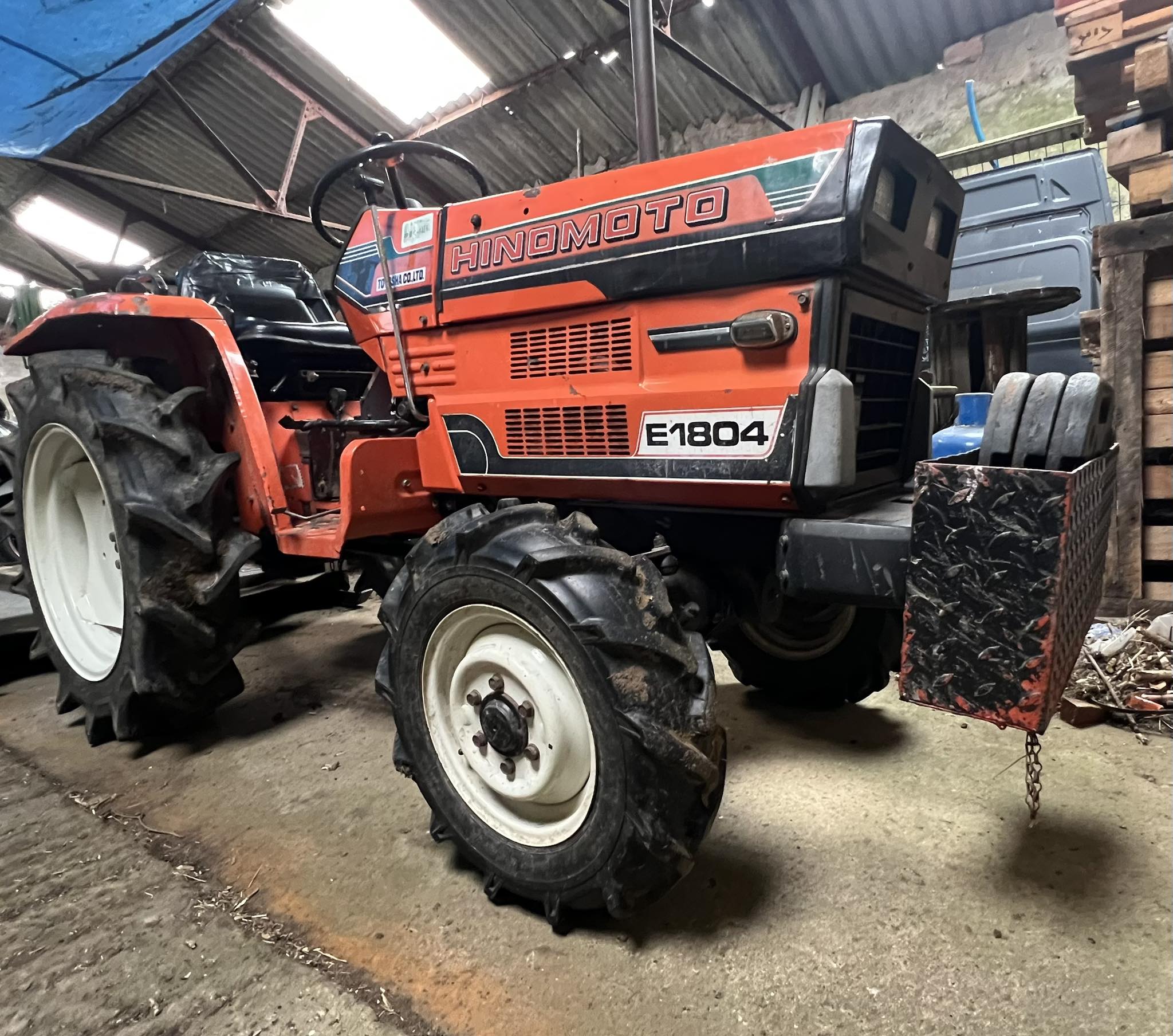 What front loader fits a Hinomoto E184 tractor?