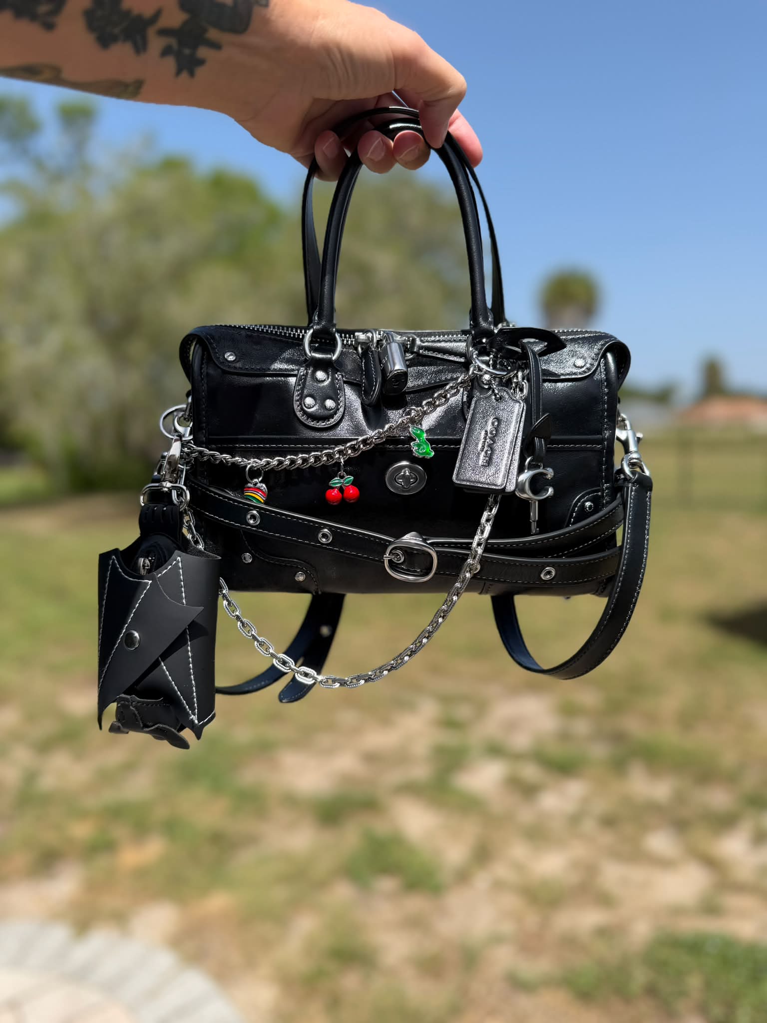 Coach Black Bag with Charms and Accessories