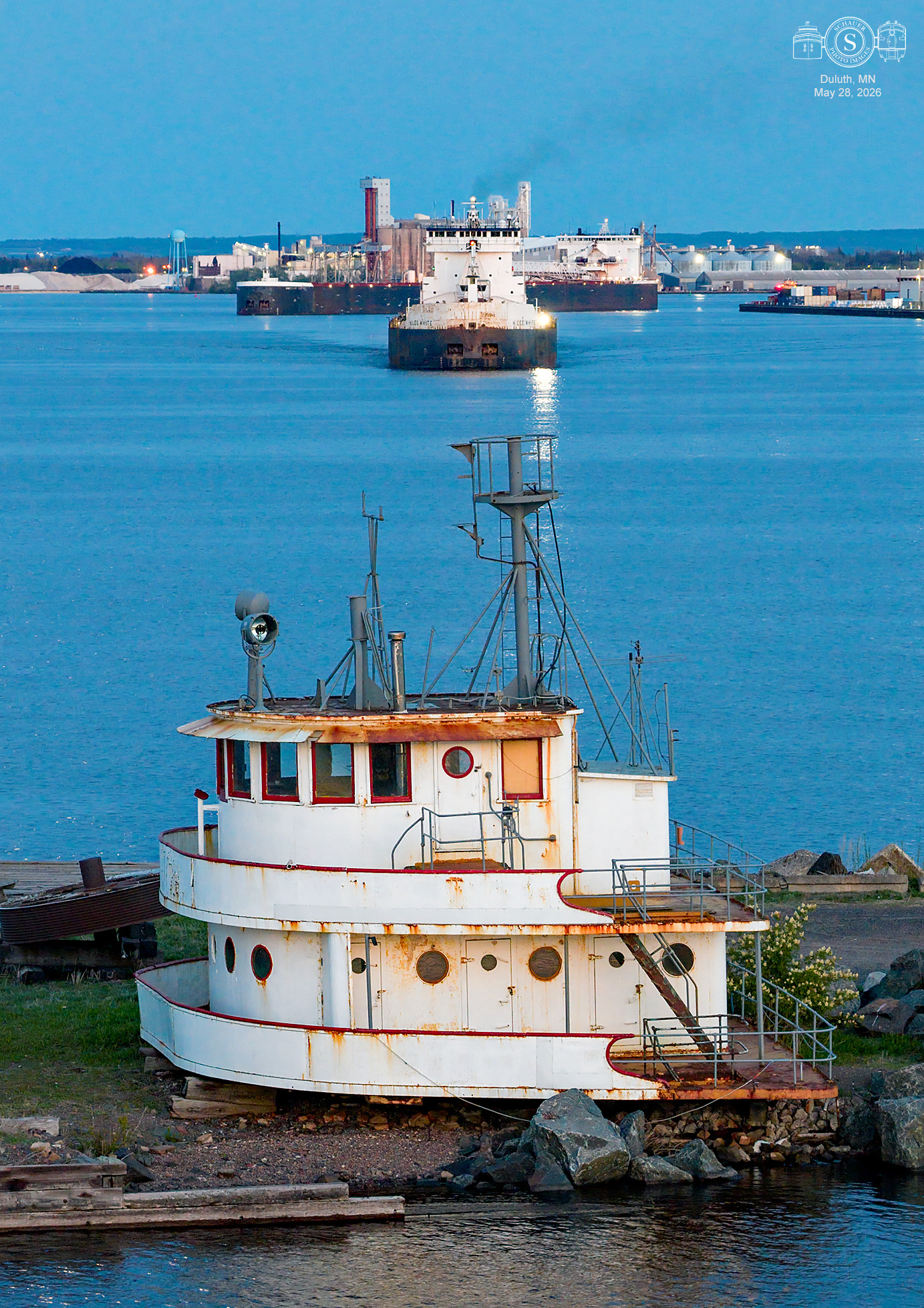 Irvin L. Clymer pilothouse watches over harbor as ships depart in 