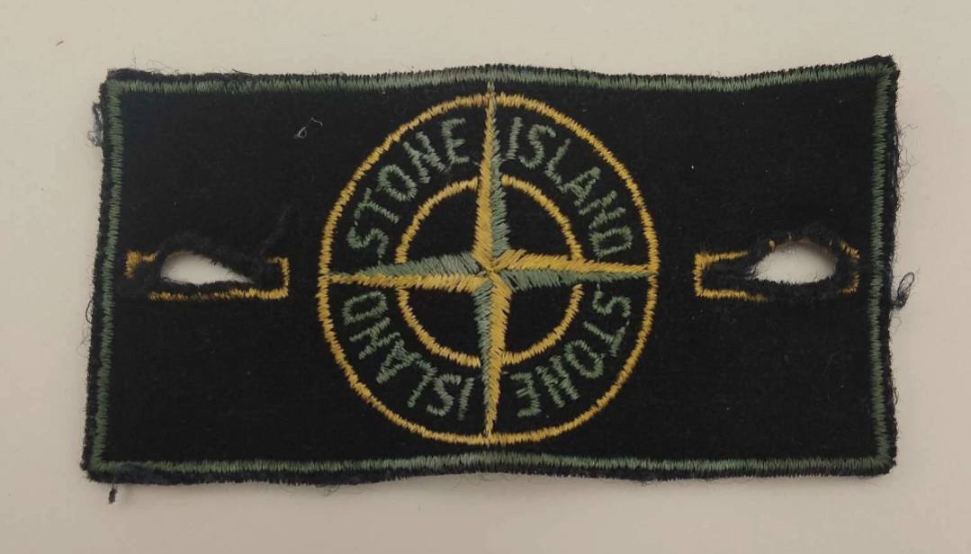 What is the Stone Island green edge badge with art number AW98?