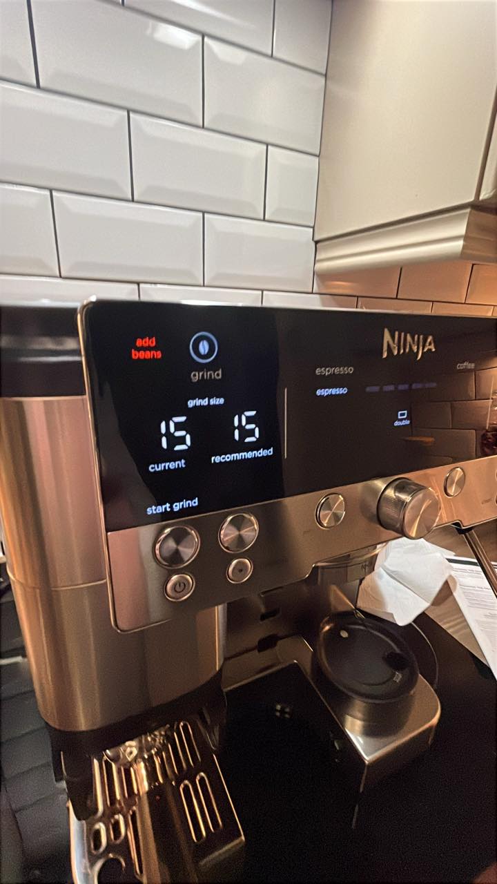 Why does my Ninja Luxe Cafe grinder say 'add beans' when the beans