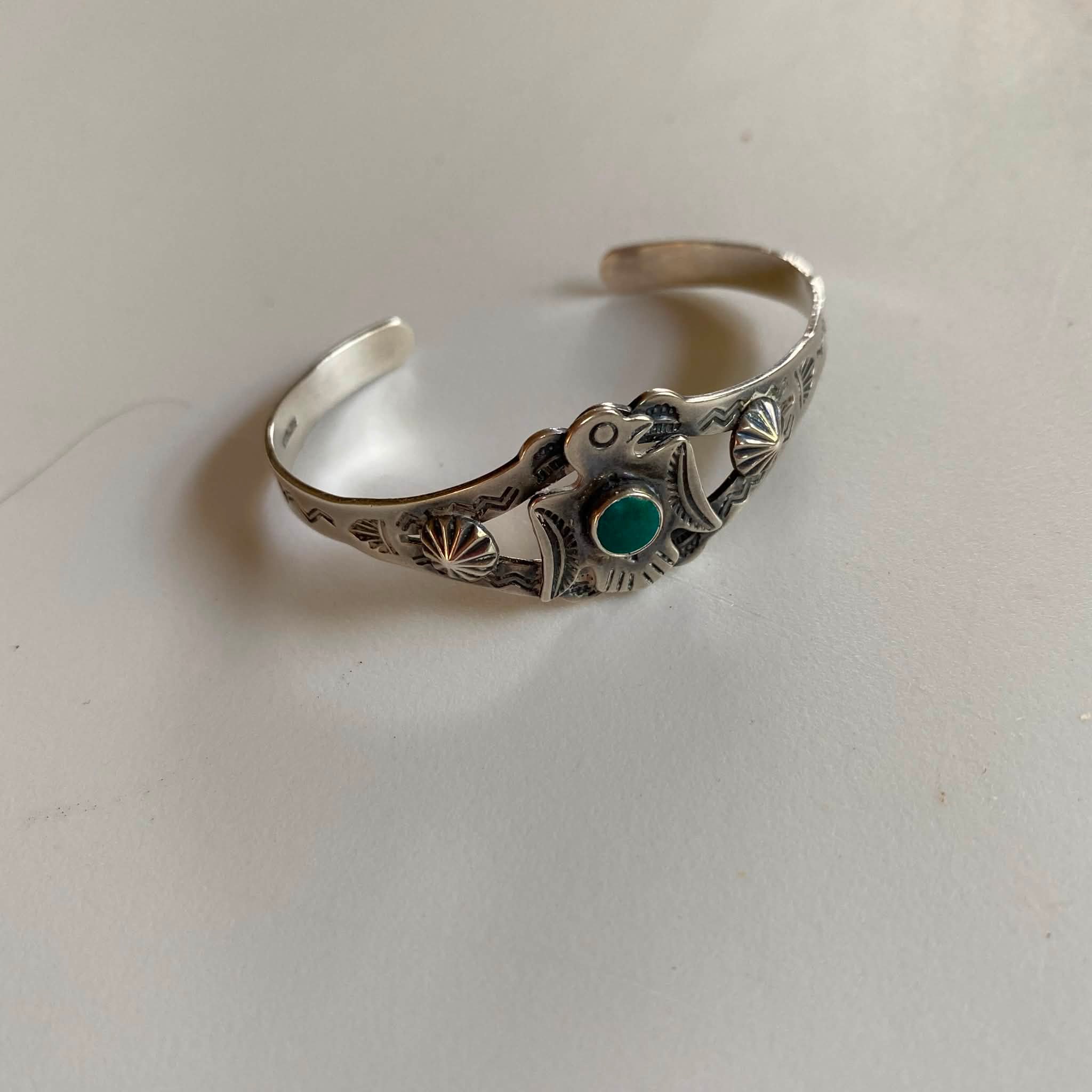 What is a Fred Harvey style thunderbird cuff with turquoise stone?