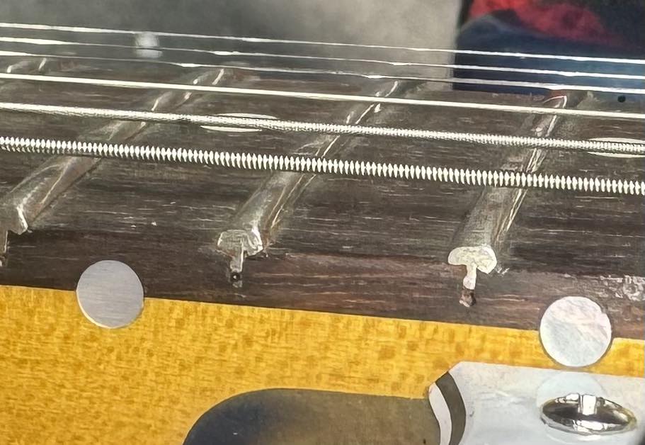 How to resolve a dispute with a guitar store over a damaged
