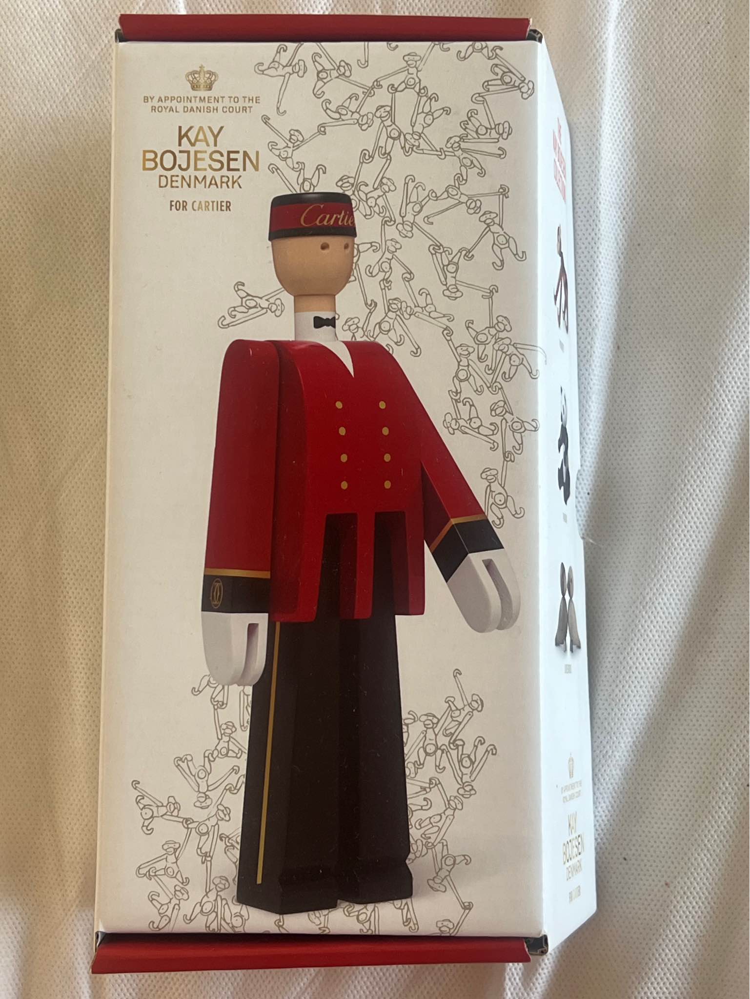 Kay Bojesen Cartier træfigur formet som piccolo i rød uniform med