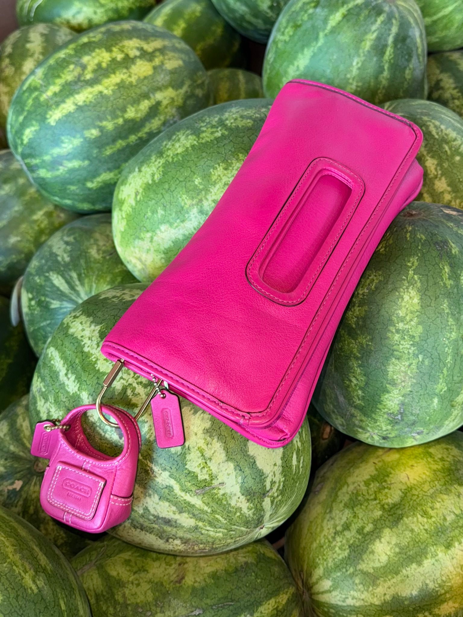Coach Legacy Hampton clutch bag in fuchsia
