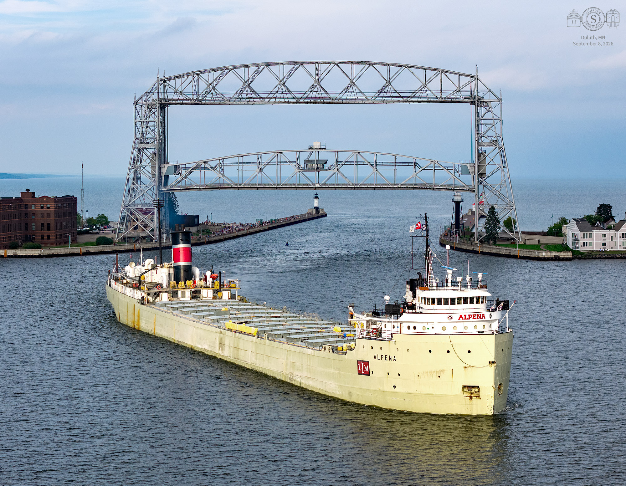 SS Alpena enters Duluth, MN harbor under 'sucker hole' of sunlight