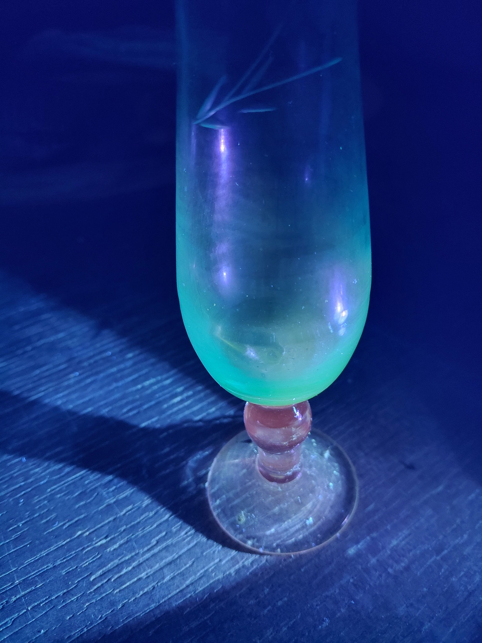 What glass has pink, blue, green, and purple colors?