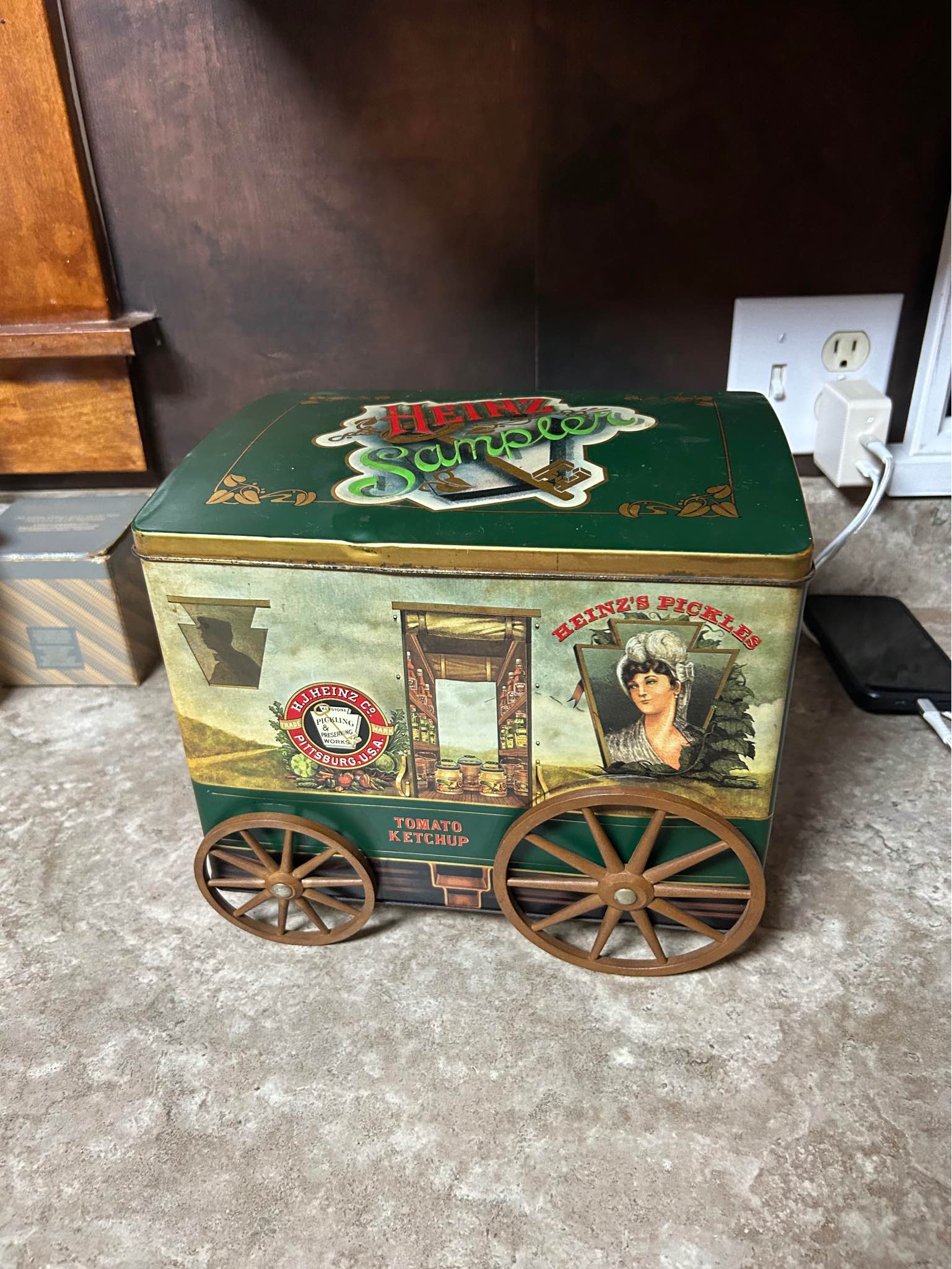 Vintage metal H.J. Heinz Co. sample tin is green with a horse
