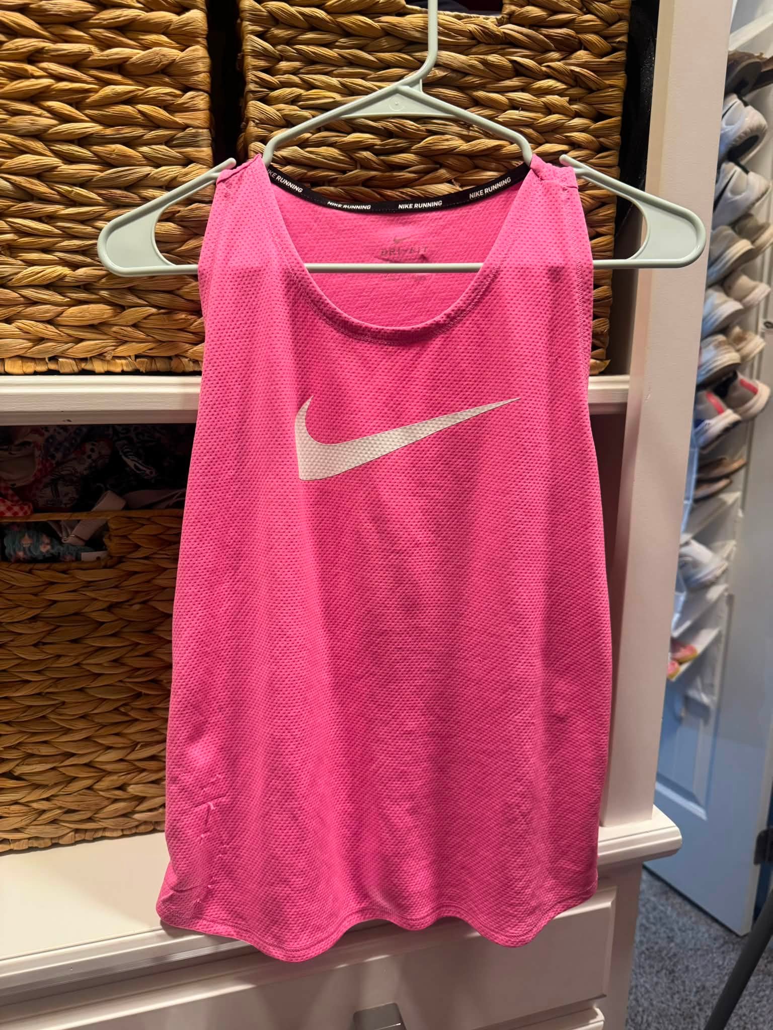 hot pink nike dress Dri-Fit athletic has a textured bodice and a strappy back design. This sleeveless dress is made from performance fabric and features a small swoosh logo on the front chest ProductID: 116555