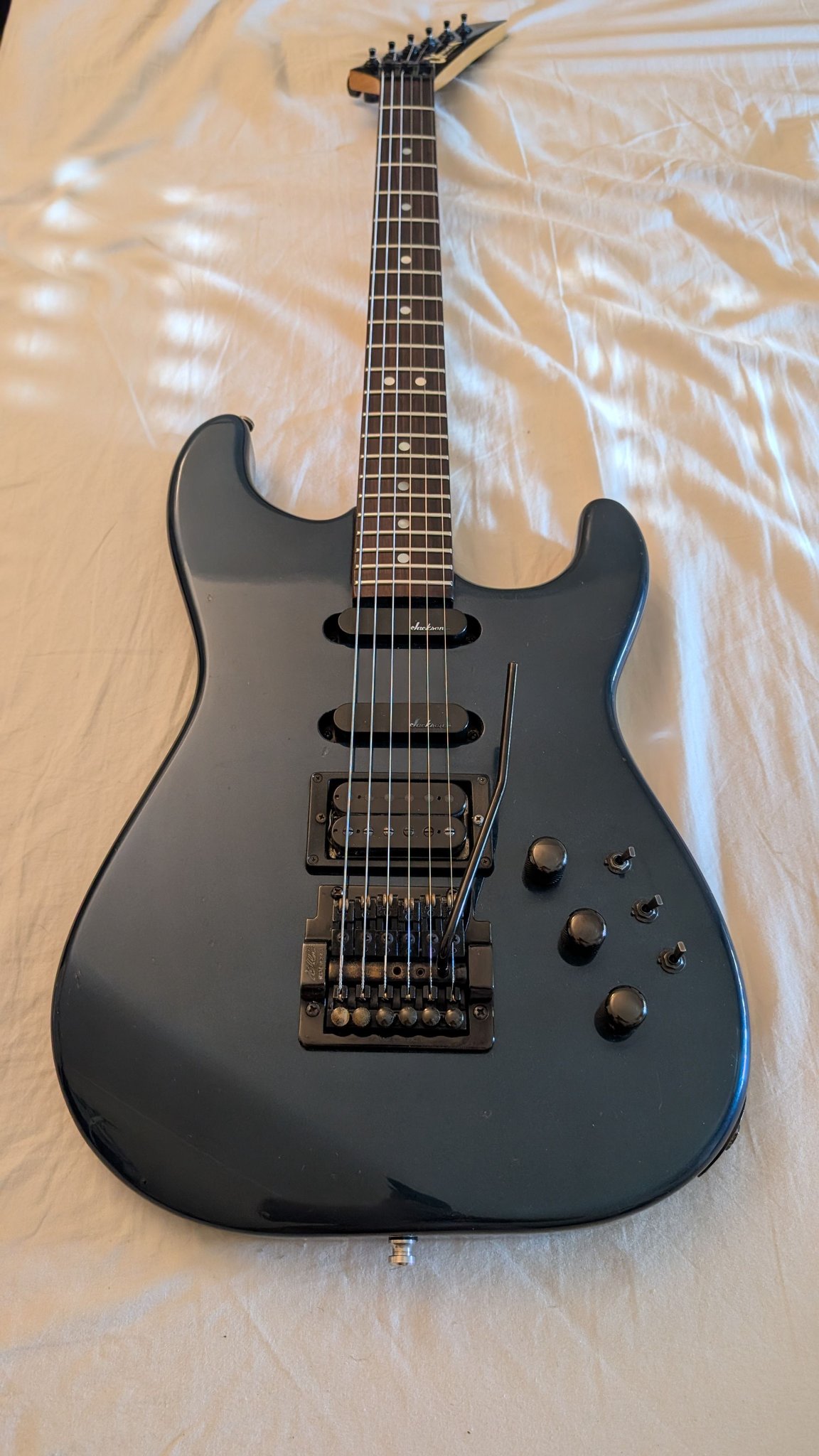Is the Kahler tremolo arm on this Charvel guitar original?