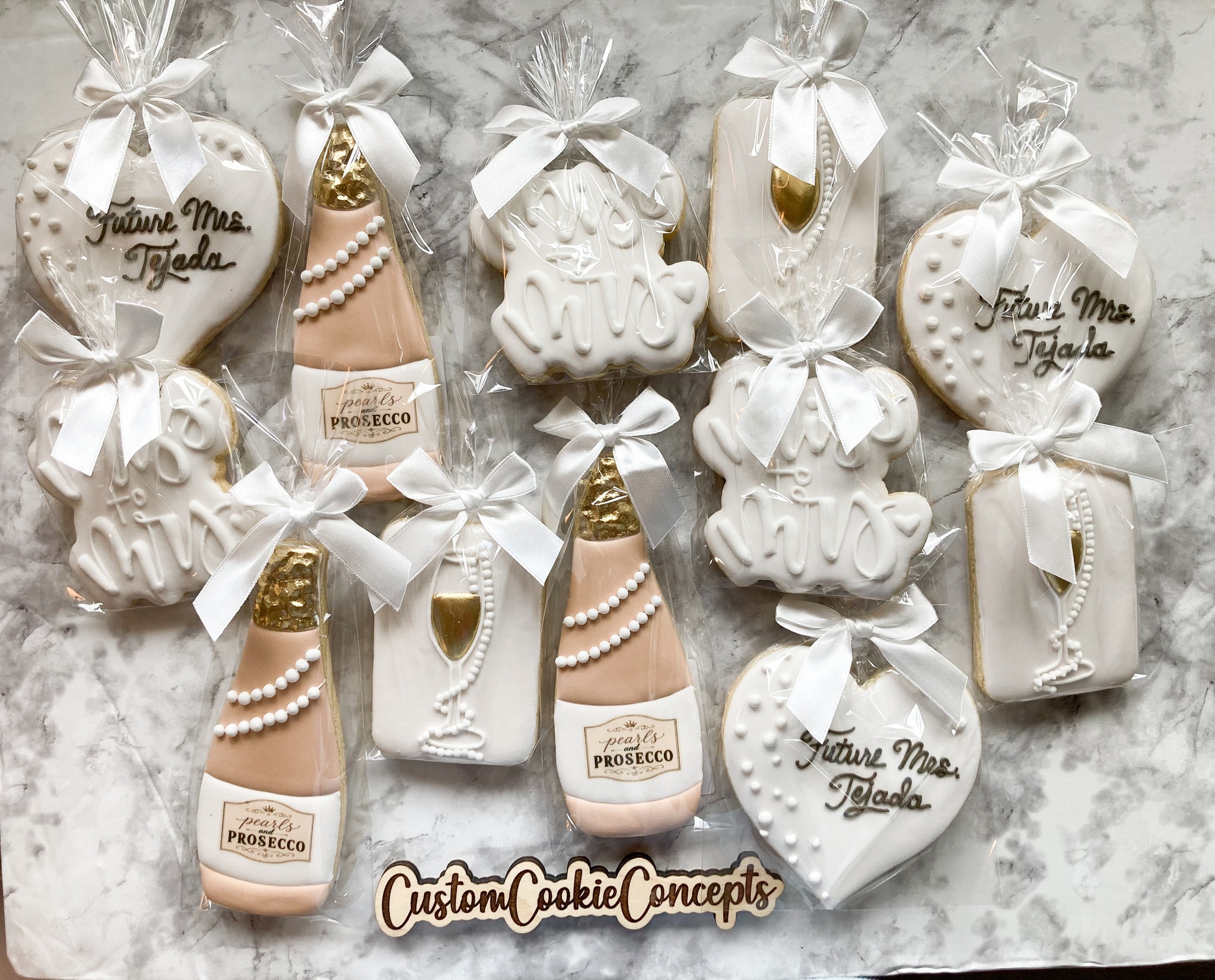 pearls and prosecco bridal shower dress themed cookies for showers by Custom Cookie Concepts pearls and prosecco bridal shower guest outfit