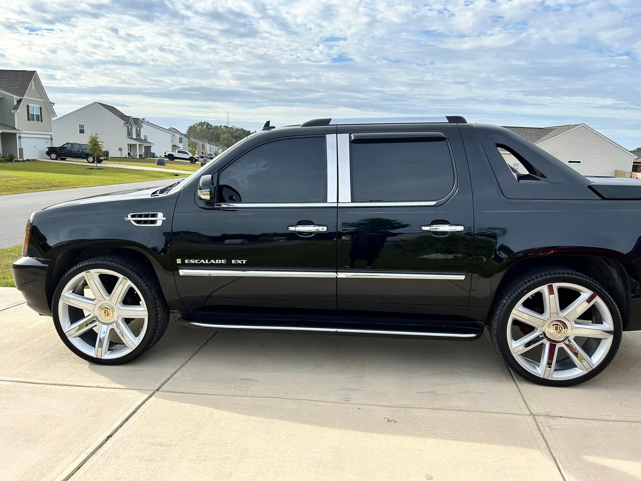 Upgraded Cadillac Escalade with 26 inch replica wheels and blacked 