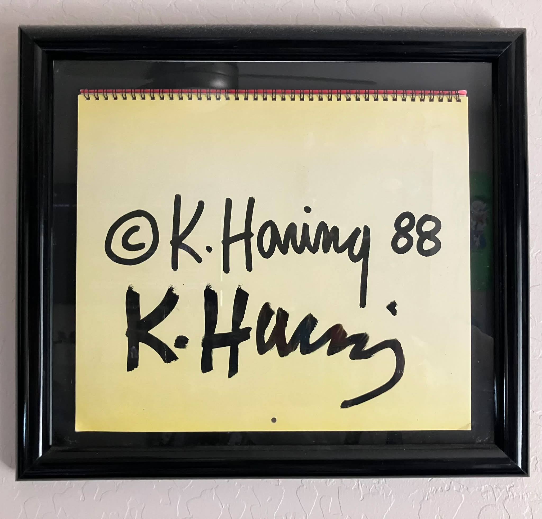 Keith Haring autographed catalog with custom drawing