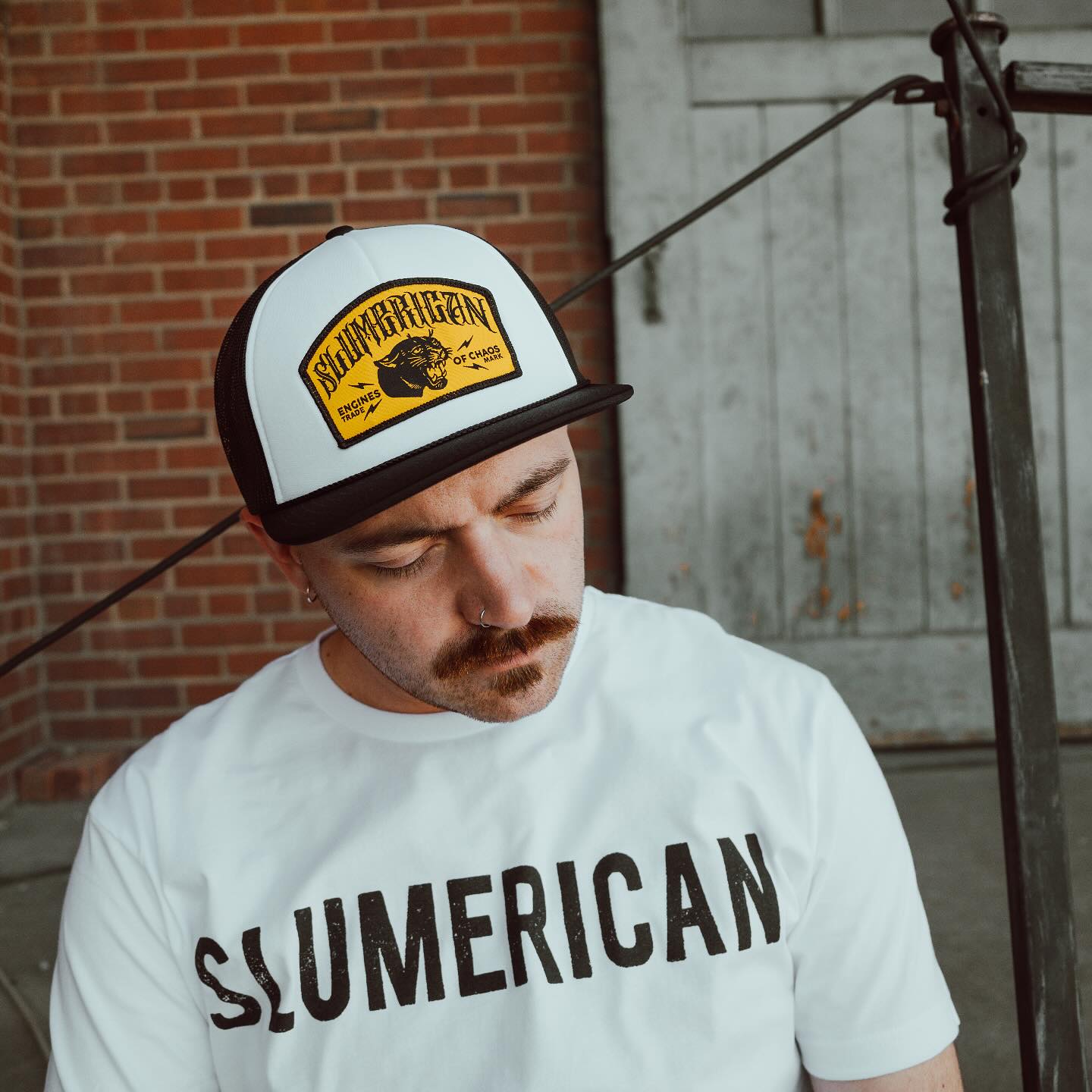 Slumerican - NEW! Chaos Trucker Hats and Tees are brand... | Facebook
