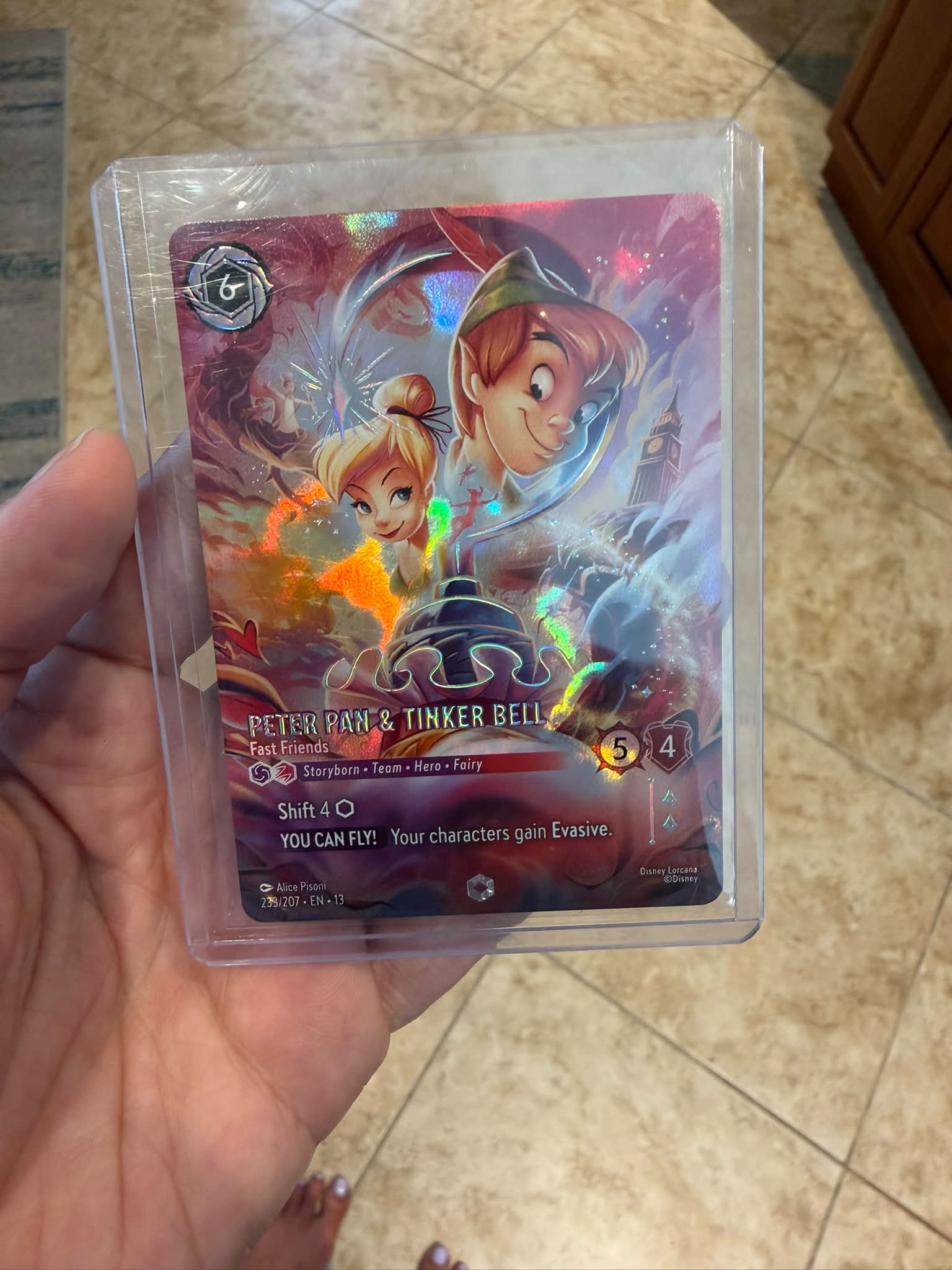 Enchanted Peter Pan and Tinker Bell card from Disney Lorcana TCG
