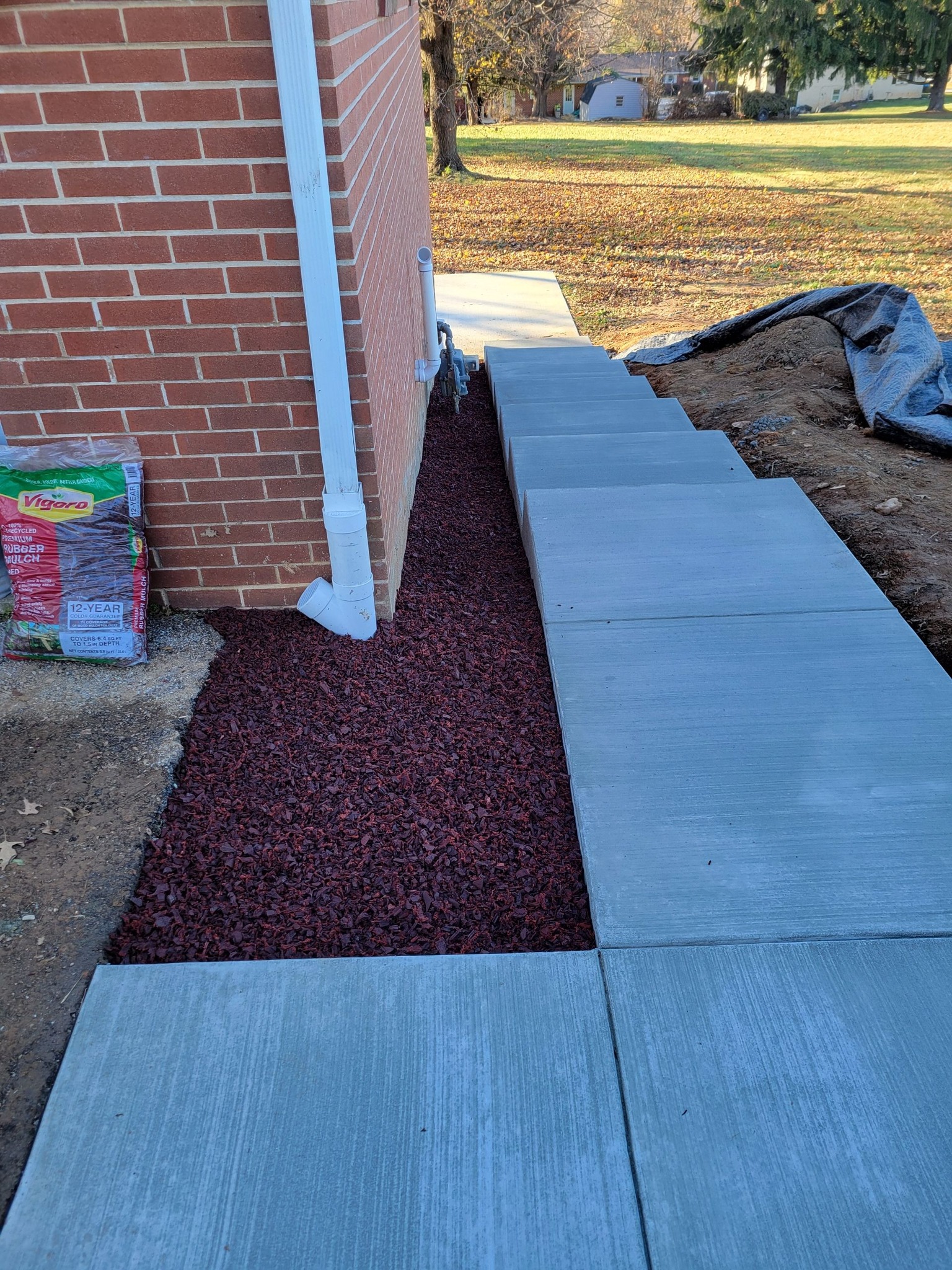 A set of steps with some red... - Walkways N' More Concrete | Facebook