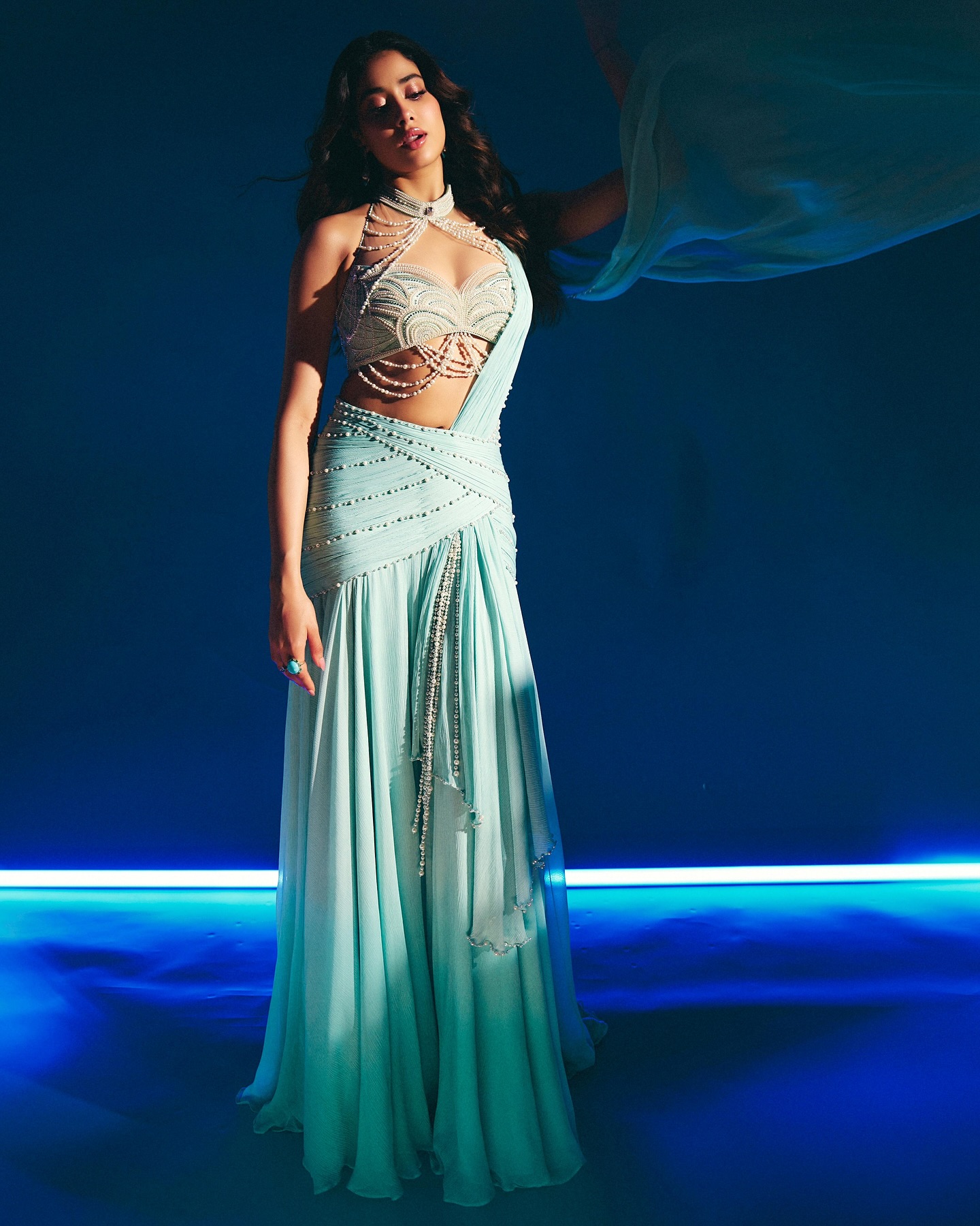 janhvi kapoor blue dress 𝗝𝗮𝗻𝗵𝘃𝗶 𝗞𝗮𝗽𝗼𝗼𝗿 𝗶𝗻 𝗖𝘂𝘀𝘁𝗼𝗺 𝗧𝗮𝗿𝘂𝗻 𝗧𝗮𝗵𝗶𝗹𝗶𝗮𝗻𝗶 Actress (@janhvikapoor) in our custom sculpted saree, with hand-embroidered pearls and sparkling Swarovski crystals, is the perfect blend of timeless beauty and Ambani wedding