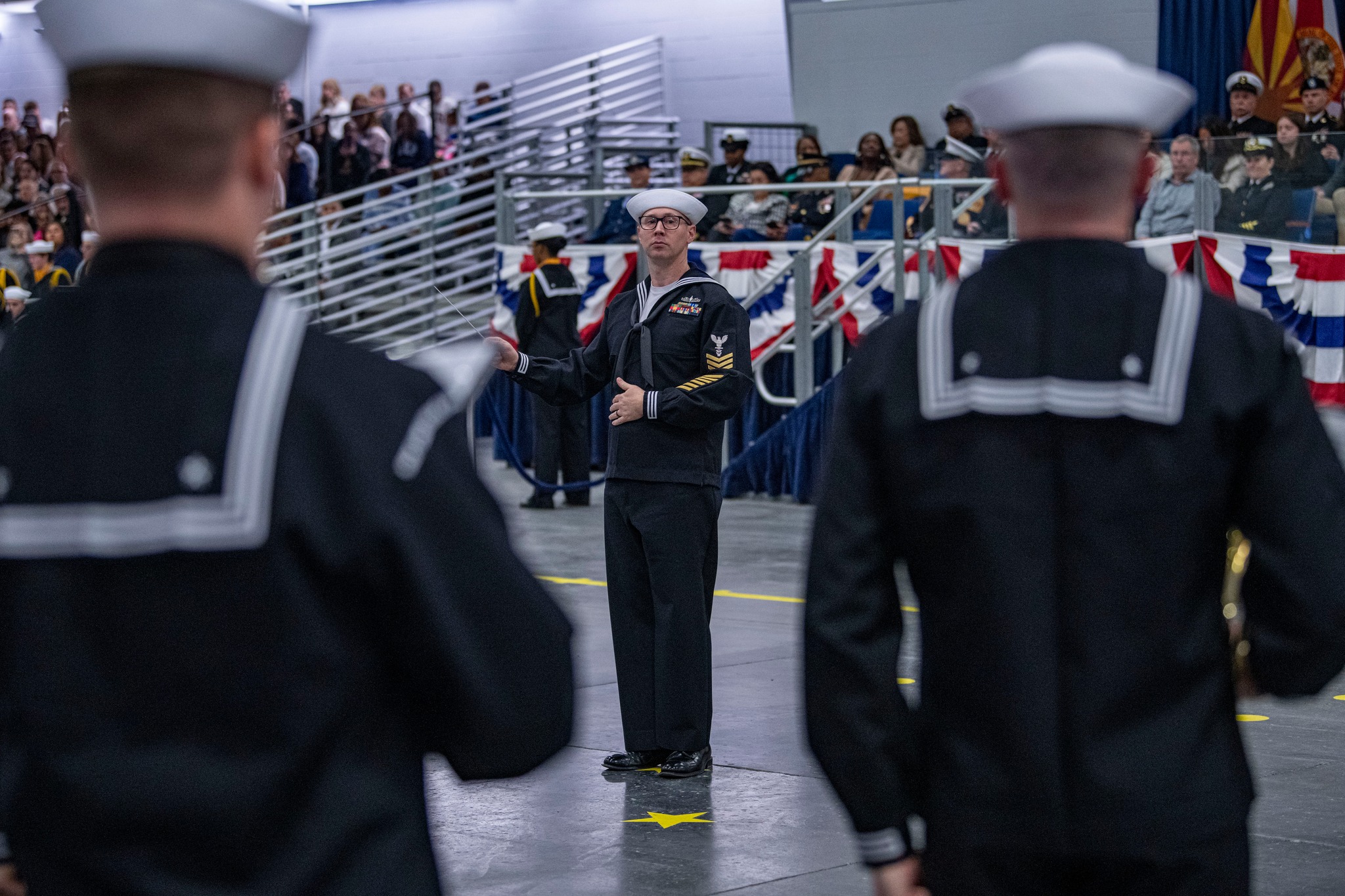 U.S. Navy Recruit Training Command - A recruit performs an air chair ...
