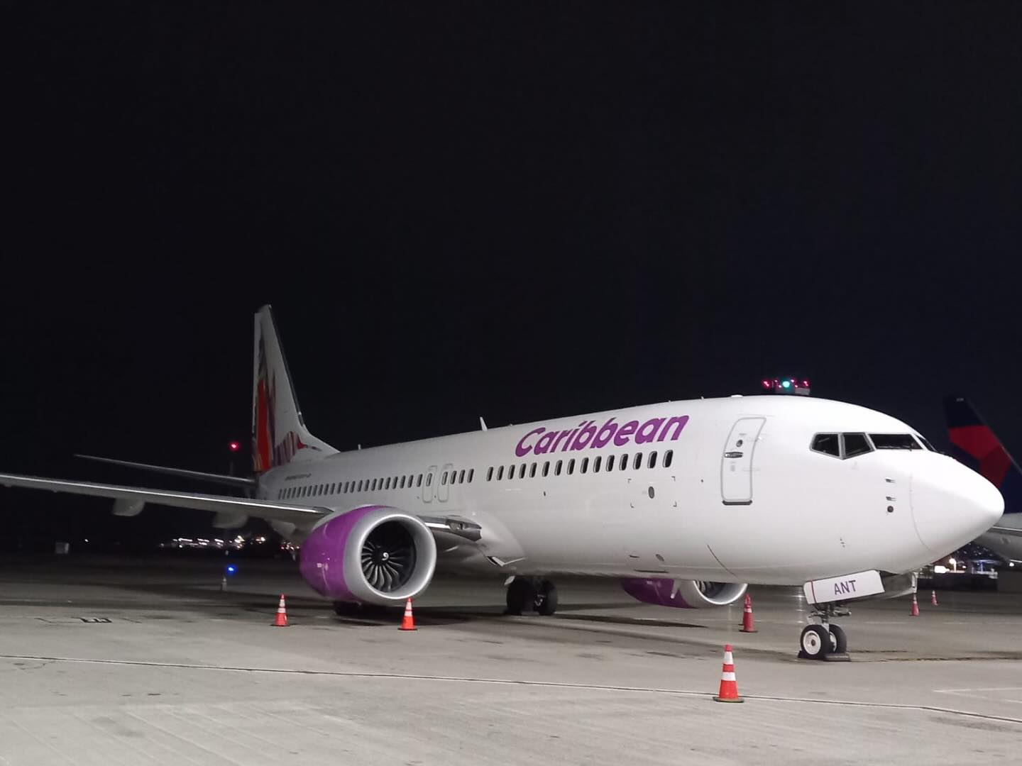 Caribbean Airlines 737-8 at Piarco awaiting its next flight