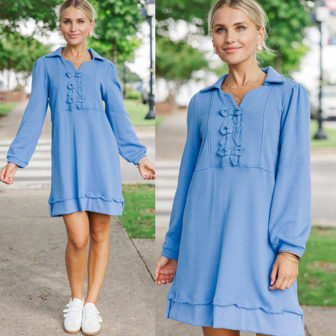 A fan favorite in a fresh blue hue. 💙 With a cozy sweatshirt feel and feminine bow details, this dress is made for casual Fridays, errands, and lunch dates. Shop This Dress >>