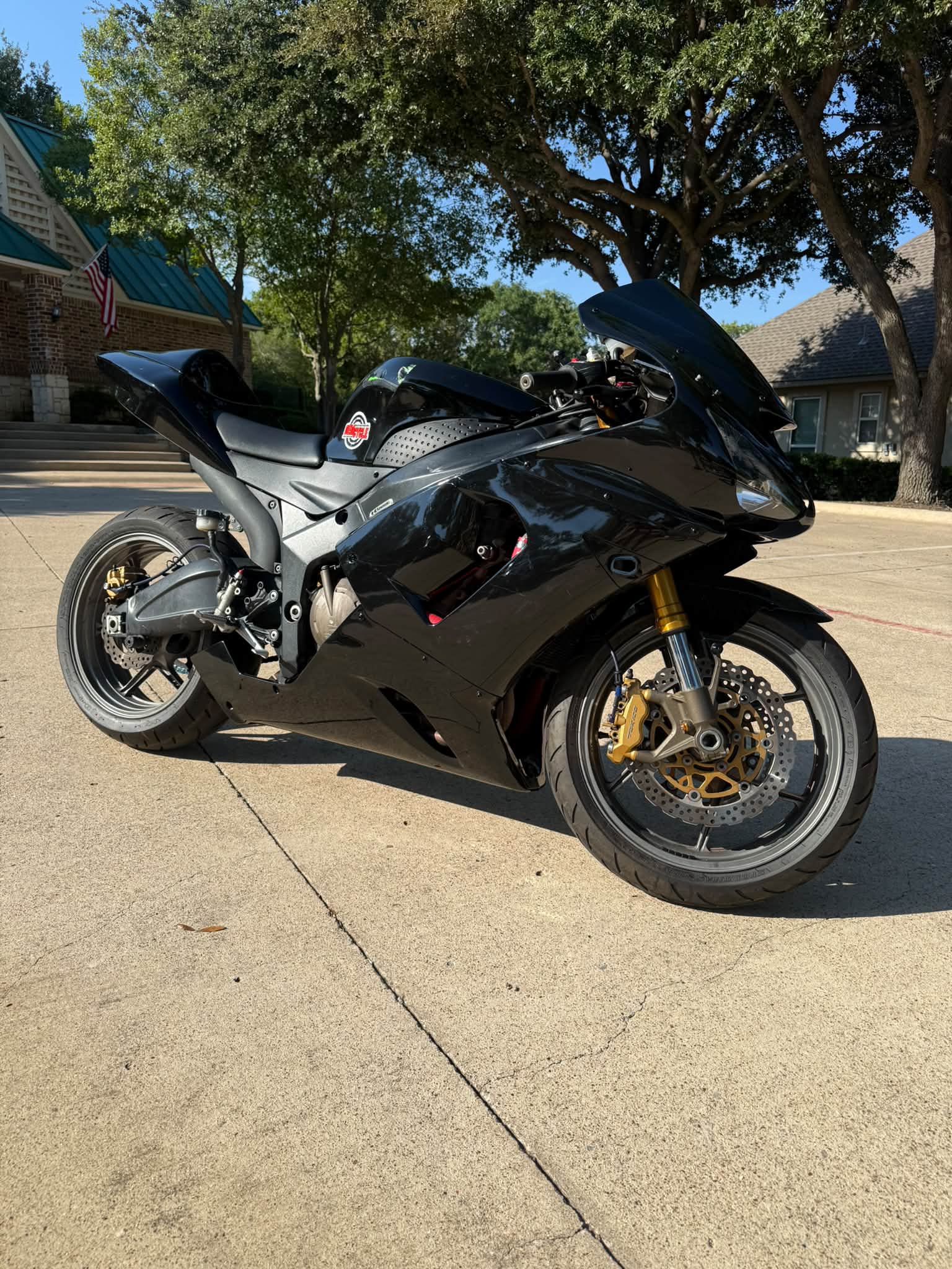 2006 Kawasaki ZX-6R 636 sport bike is black and white . This bike