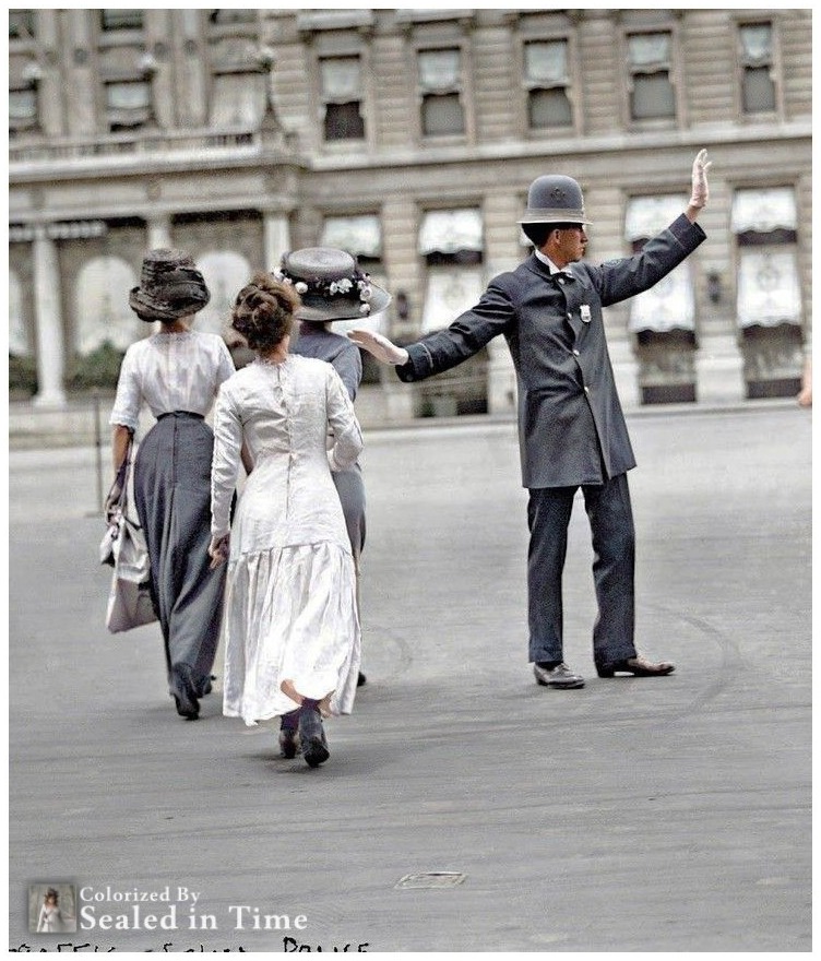 Traffic officer halts horse-drawn wagon for women in 1911