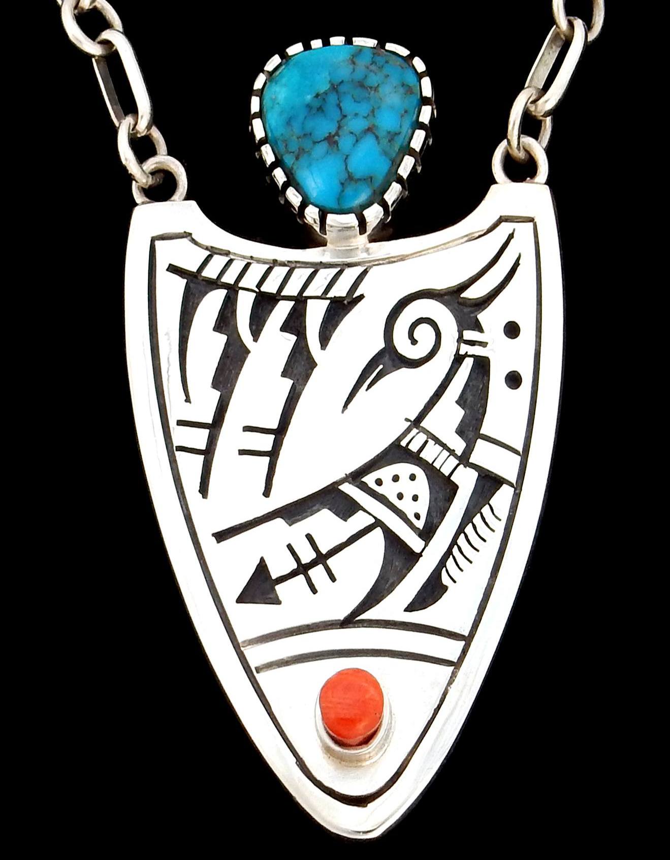 Hopi artist Roy Talahaftewa's silver earrings and gold ring