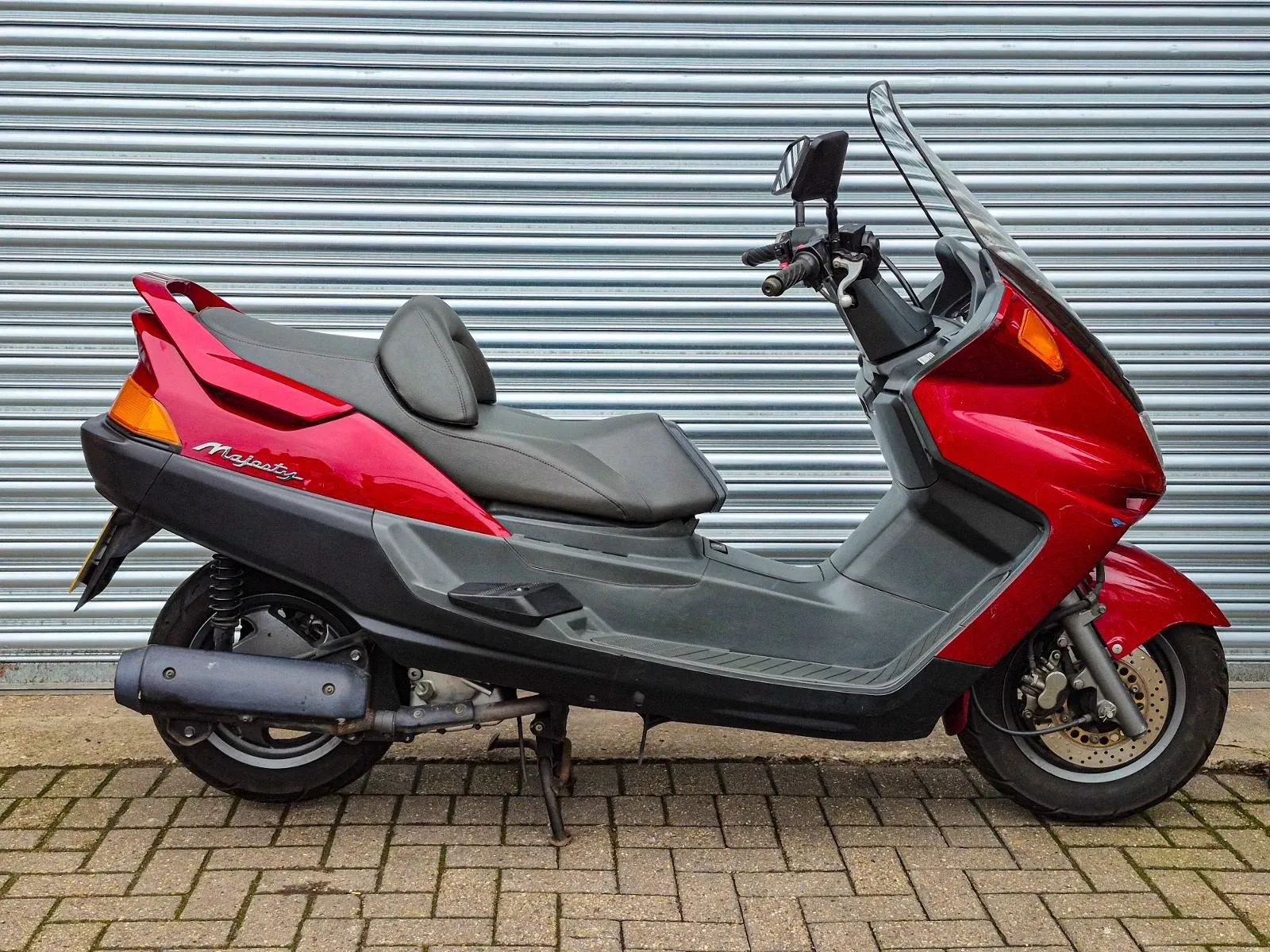 Check out this 1997 Yamaha Majesty 250 in red with only 3,728