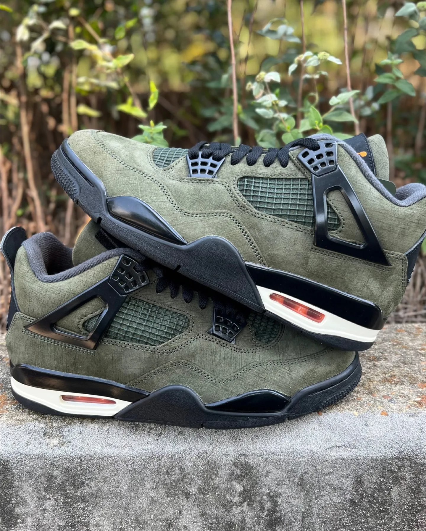 Undefeated x Air Jordan 4 Color: Deep Green/Clementine-Black-Sail 