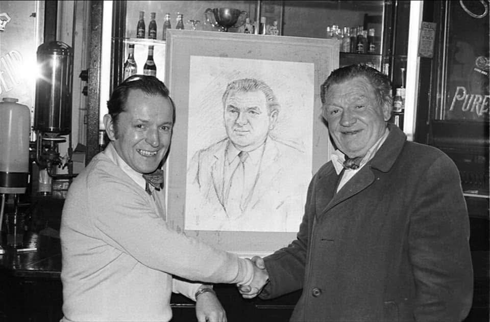 Northern - Bar owner John Roddy handing over a portrait sketch to ...