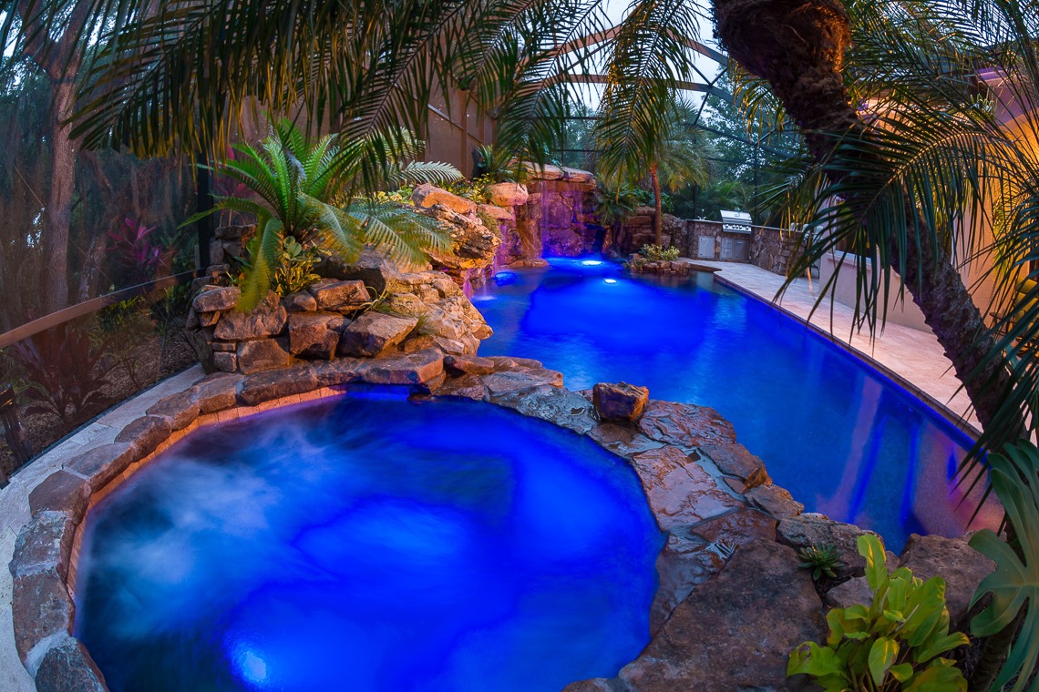Our pools shine bright at night. We... - Lucas Lagoons Design