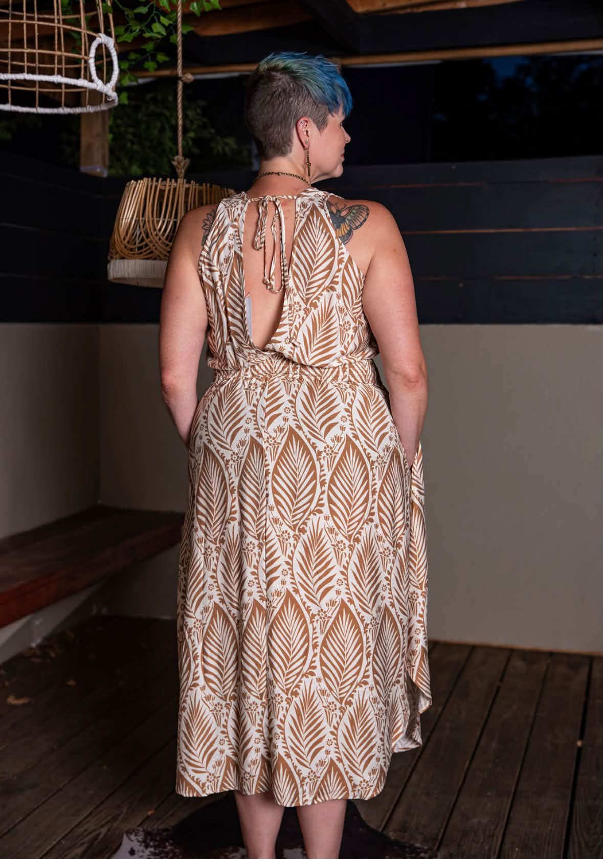 neutral flowy dress leaf print fall transition with open back Boho