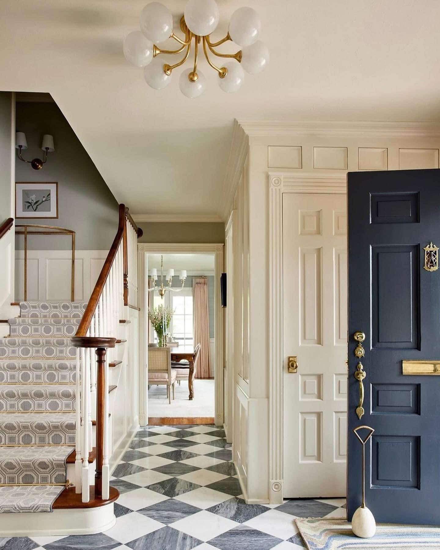 Miss - Such a pretty entry! I love the staircase situated this way ...