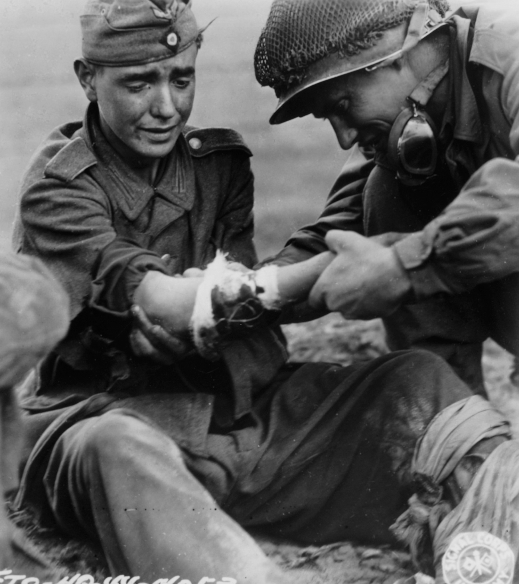 Abandoned - A young German prisoner of war looks in pain as an American ...
