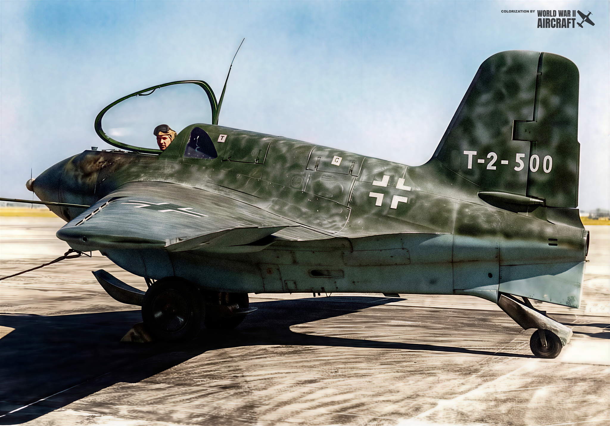 A Ki-54 twin-engine trainer sits idle on a Japanese airfield. The