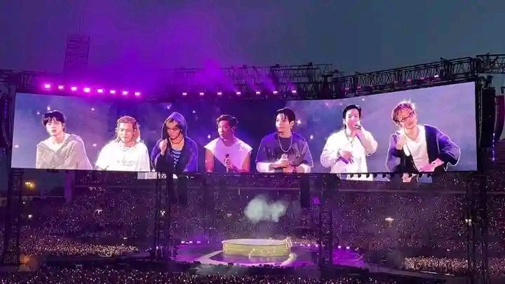 Which countries' flags are in the BTS poster in South Korea?
