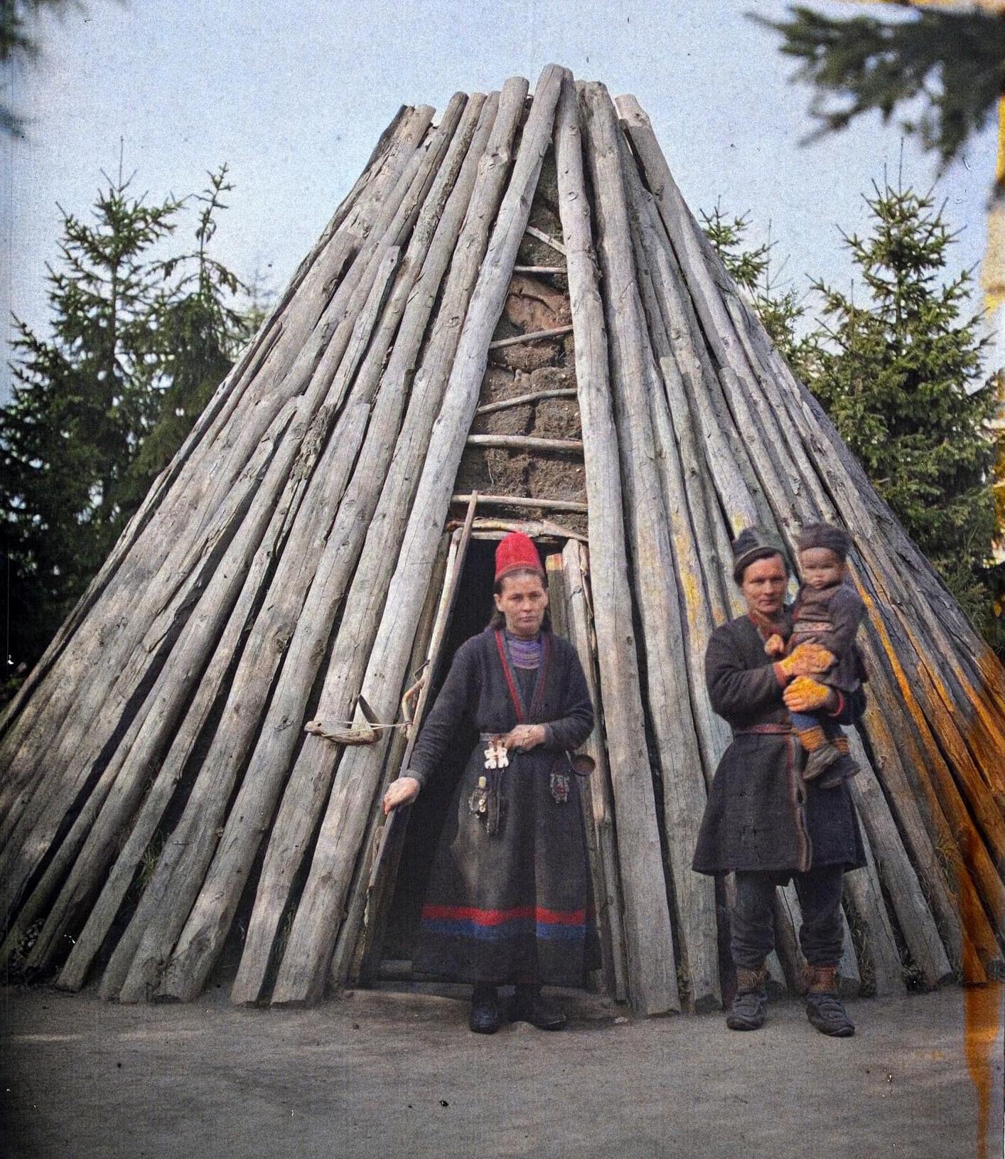 Swedish Sámi Family in front of their traditional dwelling in