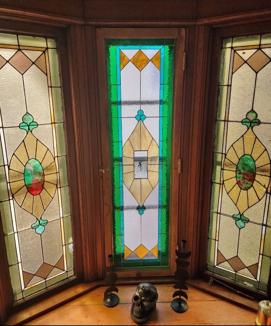 Restored stained glass window in 1892 Victorian home