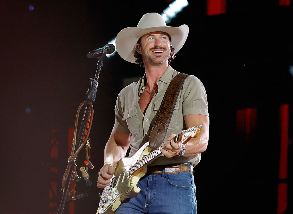 country singer dressed in black and green Every year, the summer, I shave,” artist Riley recently explained. Now, while growing his mustache back to its former glory, he's reflecting on his most recent shave the 2026-07-01