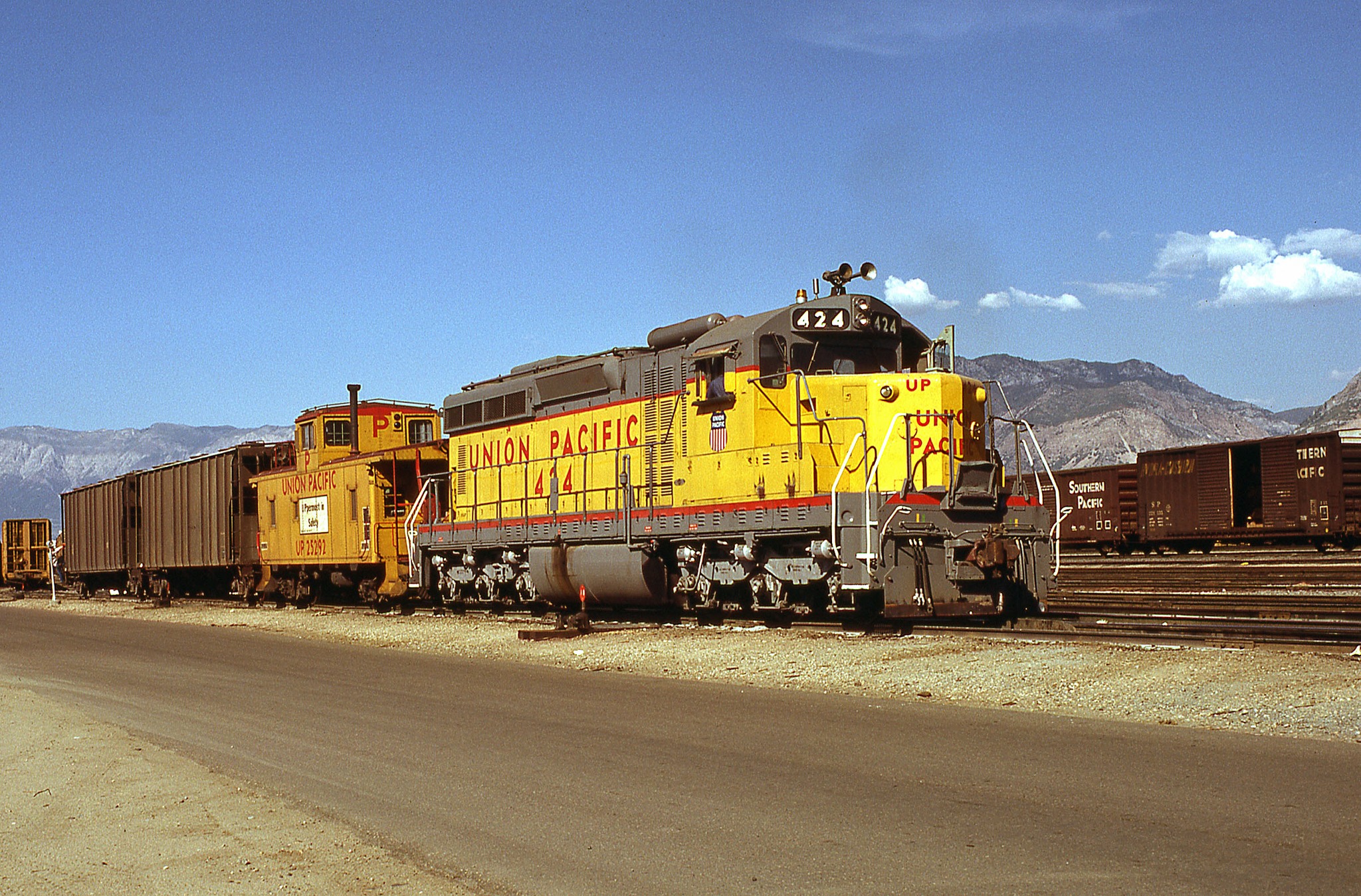 UP 77, a DD35, is the lead unit on an eastbound intermodal train 